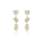 The Bezel Set Mixed Shape Diamond Drop Earrings feature three bezel-set diamonds—a heart, a baguette, and a pear—outlined in gold and arranged vertically for an elegant 18K gold look, perfect for any occasion.