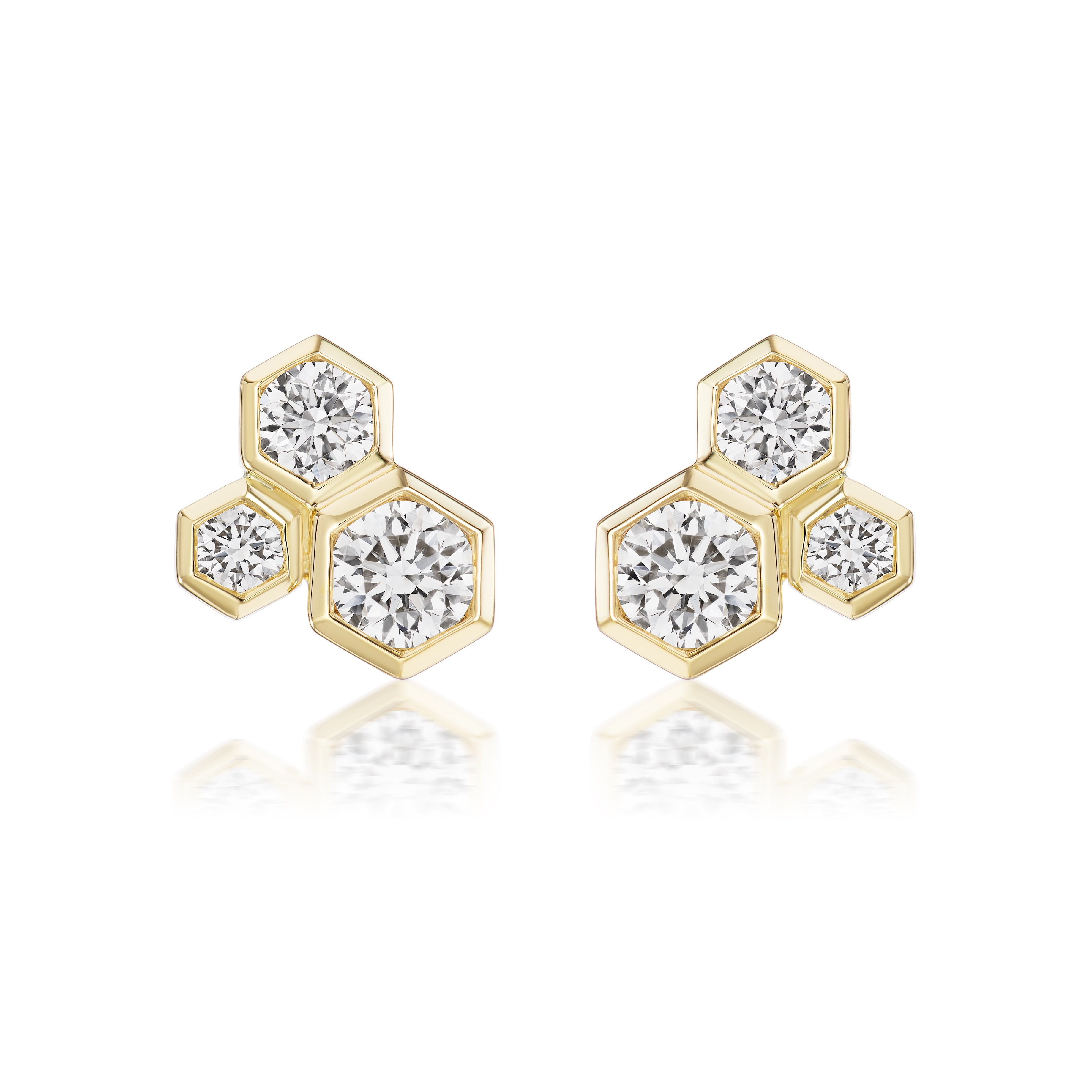 Hexagon Bezel Set Round Diamond Trio Studs in 18k gold with a honeycomb design, each hexagonal stud featuring three sparkling bezel-set diamonds. Displayed on a white background.