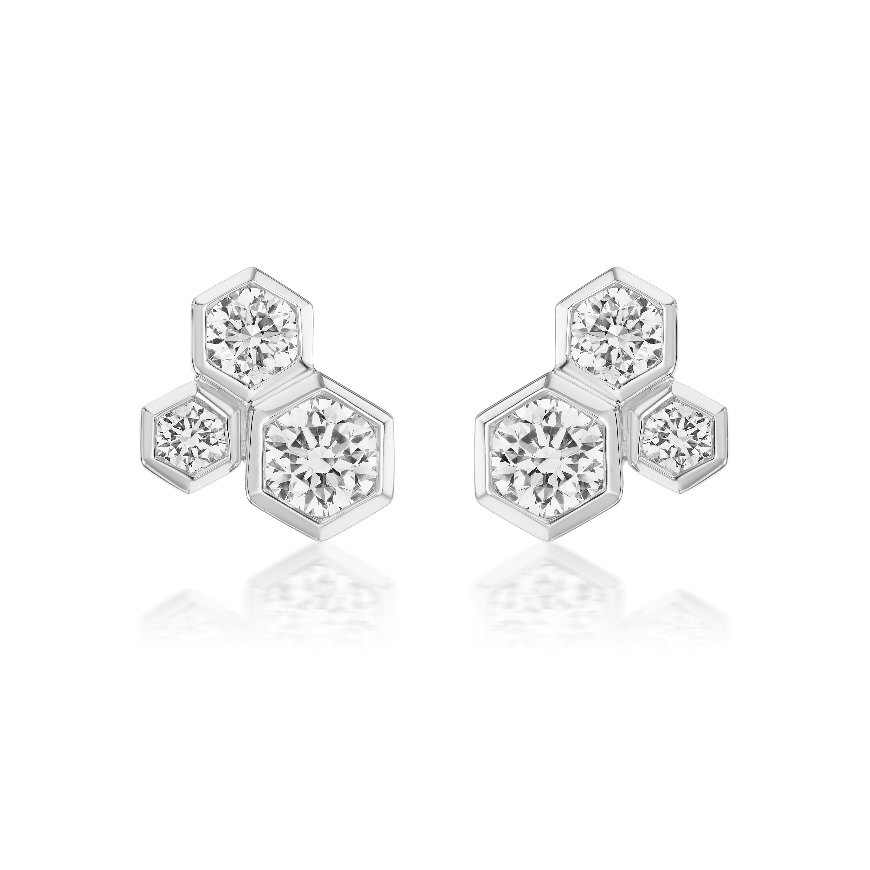 Hexagon Bezel Set Round Diamond Trio Studs feature three hexagonal shapes with sparkling round diamonds in a clustered, honeycomb-inspired design against a white background.