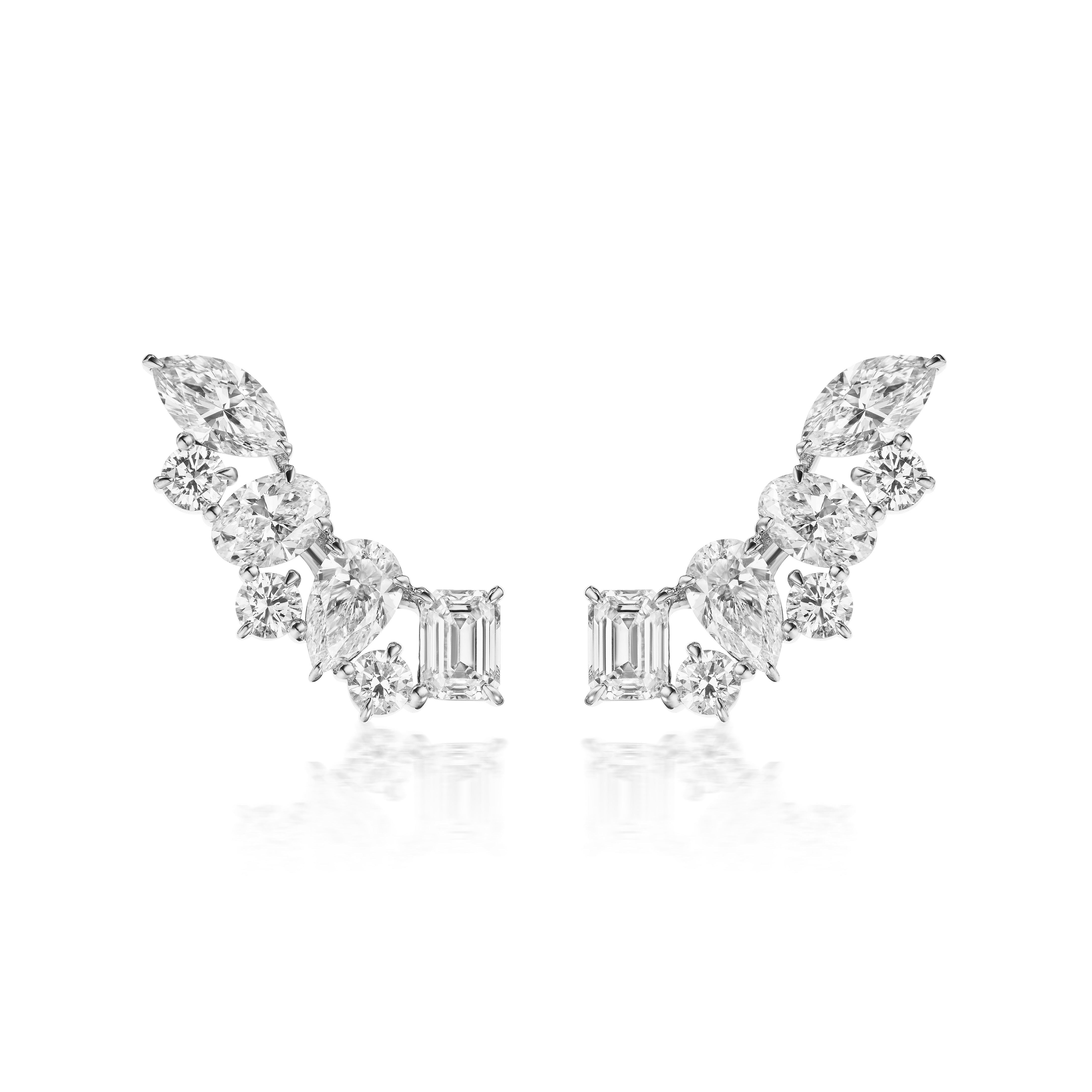 The Mixed Shape Diamond Ear Crawlers feature various diamond shapes in a curved 18k white gold setting, shown on a white background.