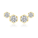 The Hexagon Bezel Set Round Diamond Duo Studs are 18k gold earrings featuring round brilliant diamonds in hexagonal frames, arranged in a chic geometric design.
