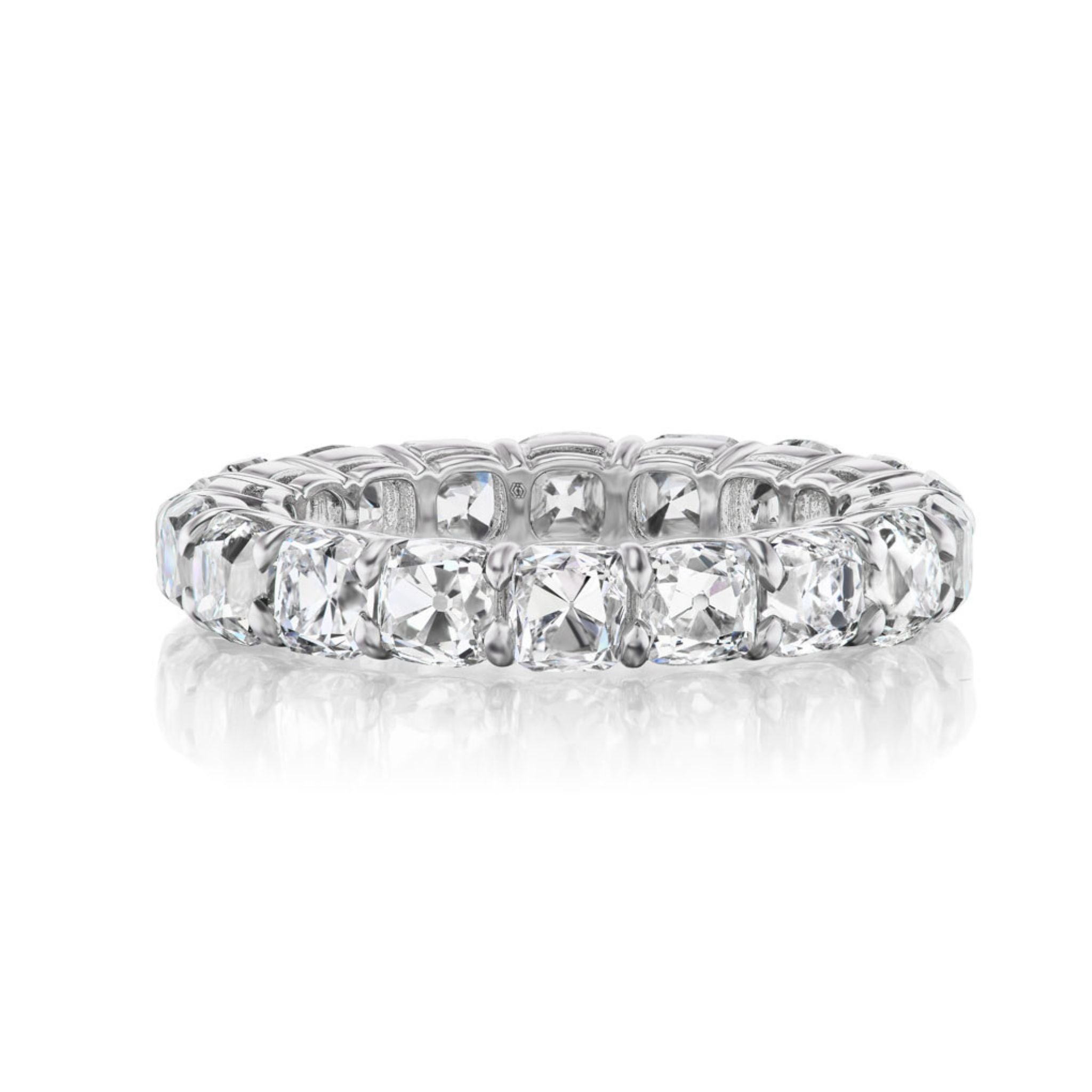 The Old Mine Cut Diamond Eternity Band features cushion-cut diamonds set in a continuous circle on a platinum or white gold band, shown against a white background.
