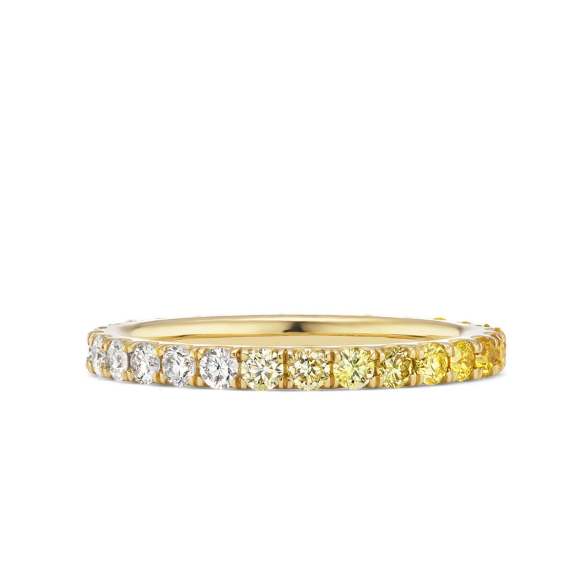 The Ombré Eternity Band features radiant cut yellow sapphires and white diamonds in a stunning gradient design—an elegant choice for any celebration.