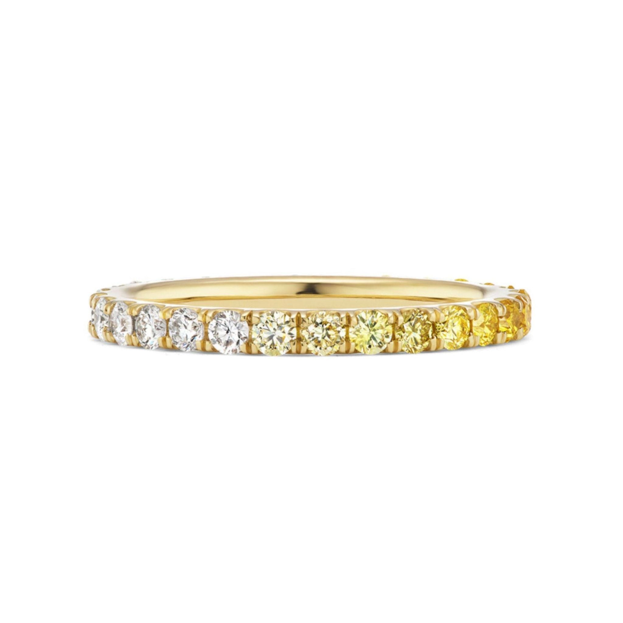 The Ombré Eternity Band showcases radiant cut yellow sapphires and white diamonds in a seamless gradient, transitioning from sparkling white to vibrant yellow.
