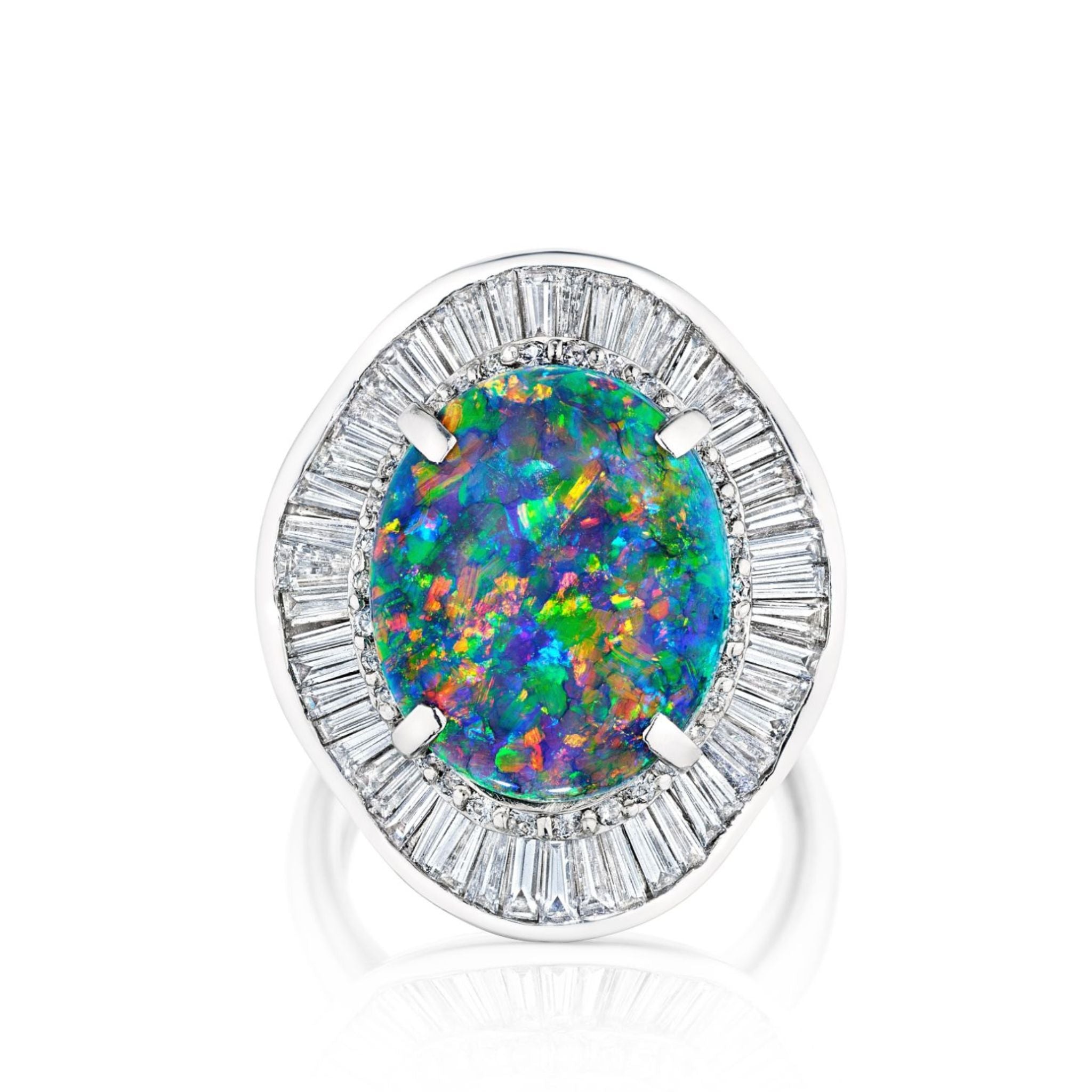 The Opal and Diamond Ring showcases an oval opal with vivid blue, green, and orange hues, encircled by a radiant halo of baguette diamonds set in platinum.