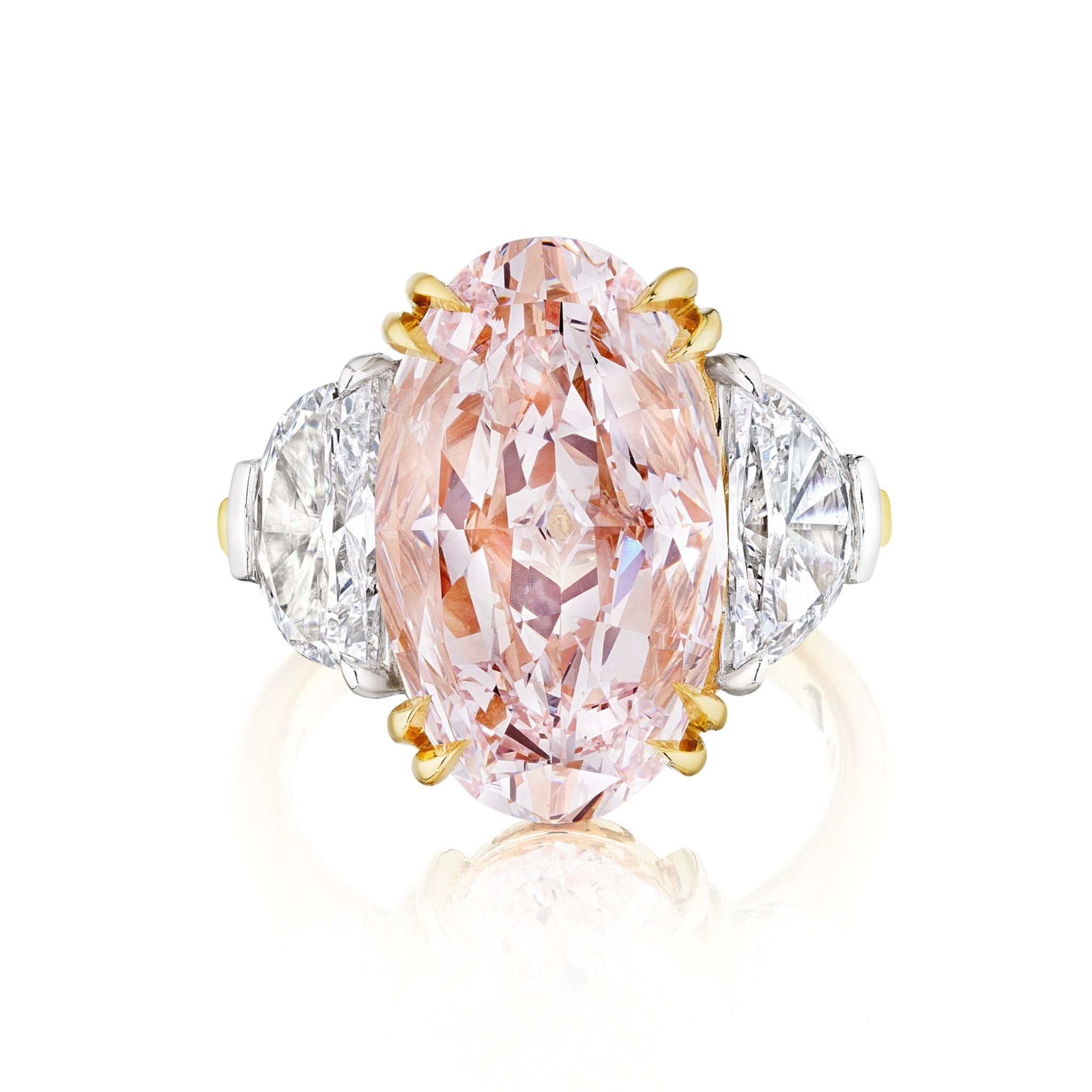 The Oval Pink Diamond Engagement Ring features a large pink oval diamond with epaulette diamond side stones, set in platinum and yellow gold.