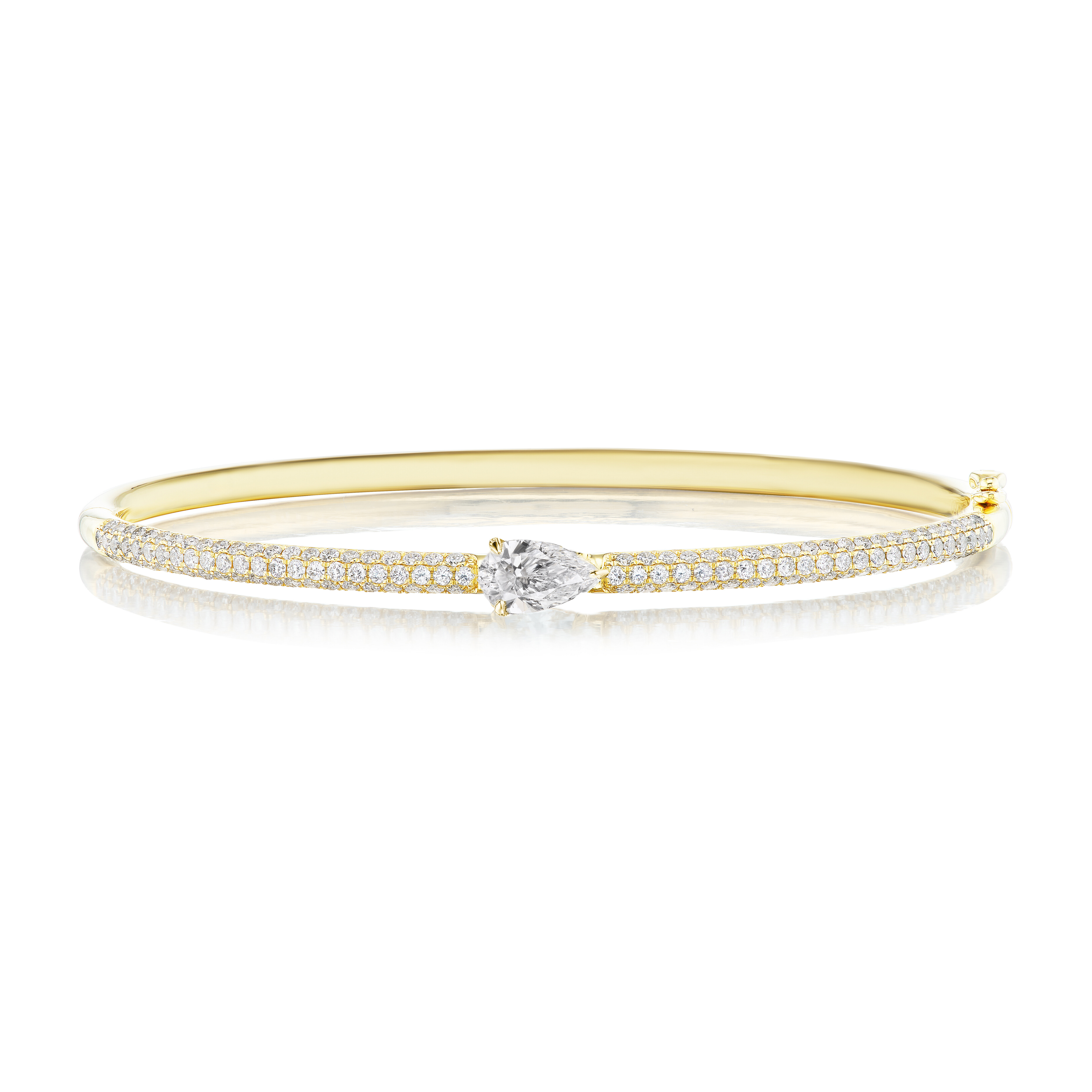 The East-West Set Pear Shape Diamond Pavé Bangle showcases a large center pear-shaped diamond, with pavé-set round diamonds along the 18k gold band. Photographed on a white background for an elegant effect.