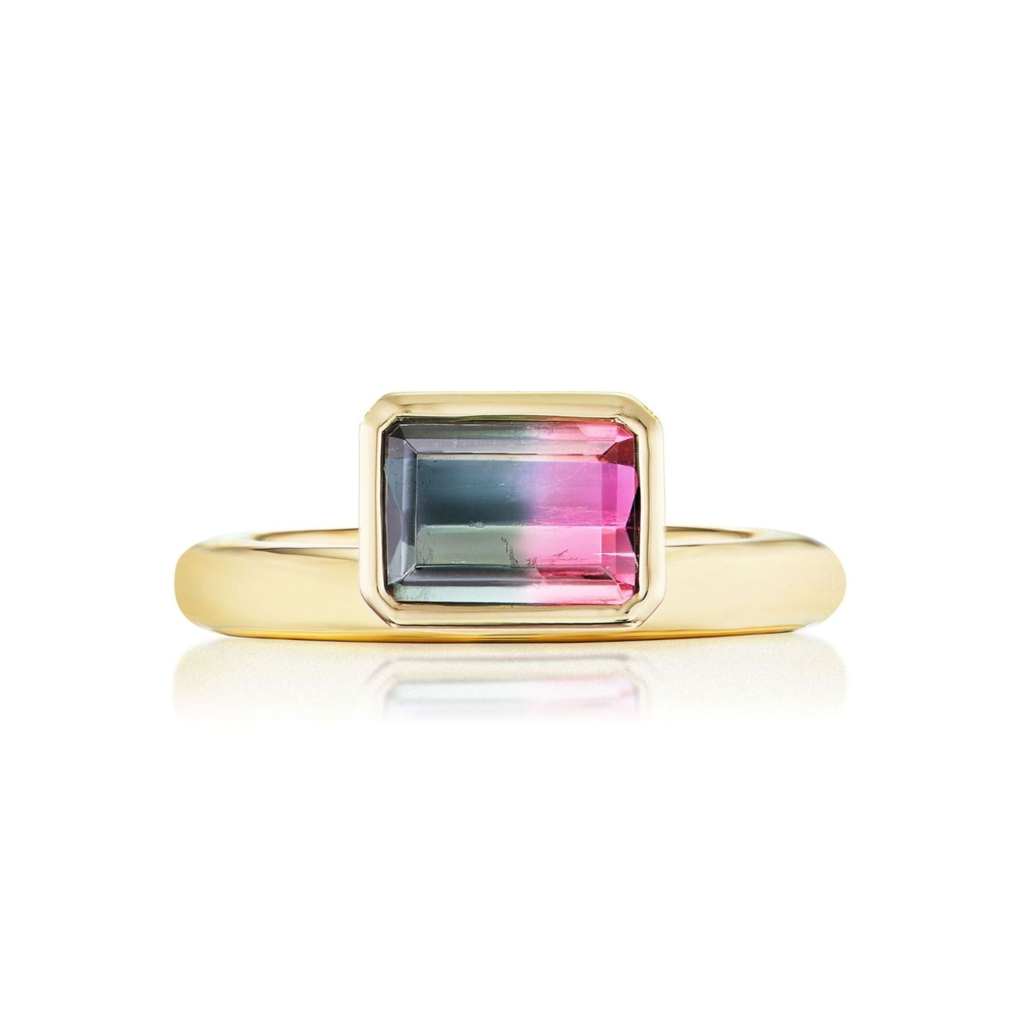 Introducing the Pinky Ring in Yellow Gold with Emerald Cut Watermelon Tourmaline: an eye-catching 18k yellow gold ring showcasing an emerald cut watermelon tourmaline with captivating pink and green hues, elegantly set in a refined bezel setting.