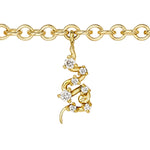 An America250 charm bracelet in yellow gold featuring ruby, pearl, sapphire, and diamond accents.