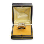 A Mauboussin Gold and Diamond Ring, circa 1940, is displayed in an open vintage M. Fouassin jewelry box with a yellow velvet and satin lining.