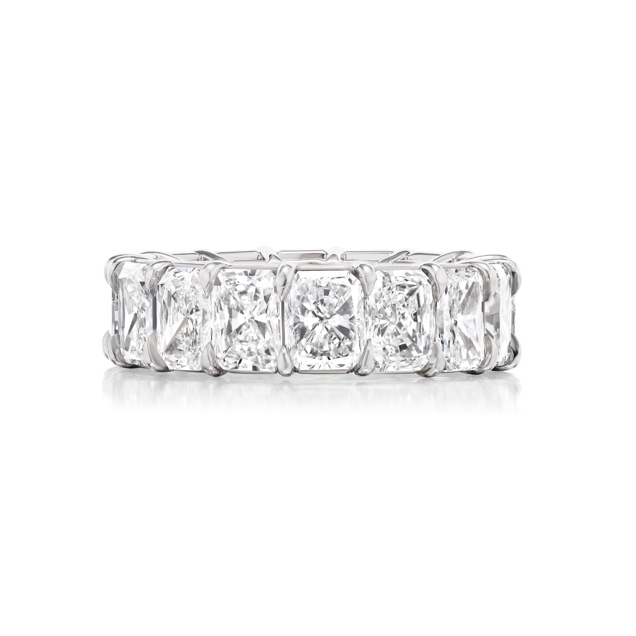 The Radiant Cut Diamond Eternity Band features a continuous row of radiant-cut diamonds set in white gold or platinum—a dazzling option for bridal or celebration rings.