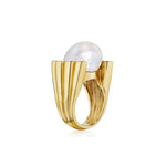 The Cultured Pearl and Diamond Ring features a large baroque cultured pearl set atop a sculptural, fluted band. Expertly crafted in 18K gold, this elegant design is enhanced with sparkling diamonds for added sophistication and timeless appeal.