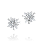 Introducing the Mixed Shape Diamond Ear Jacket in White Gold by Serpentine Jewels—a dazzling design featuring a large round center stone adorned with an array of marquise, baguette, and round-cut diamonds in a striking starburst pattern. This versatile piece is set in radiant white gold and can be paired with its chic ear jacket for added elegance and styling options.