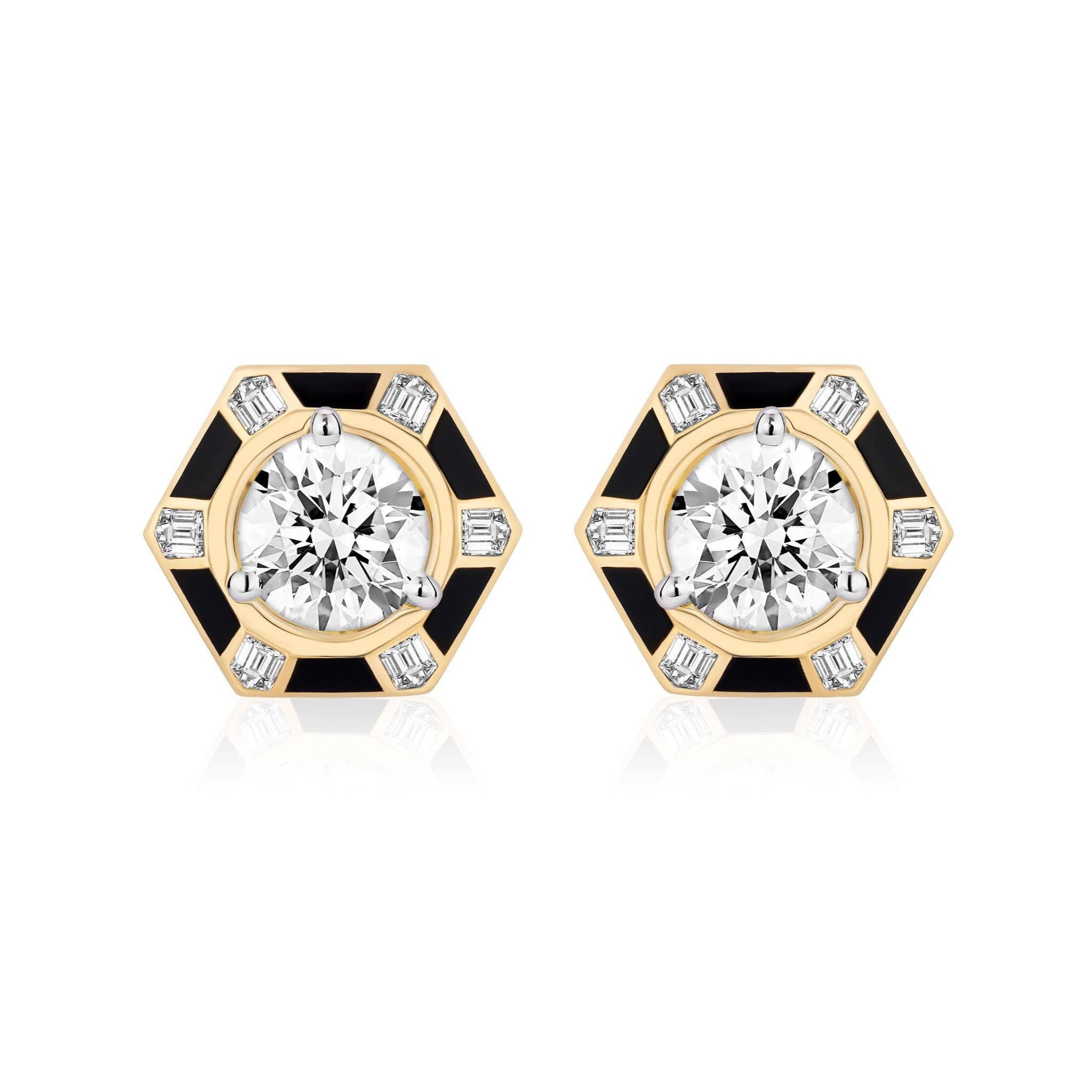 Hexagon Alternating Onyx and Diamond Ear Jackets in 18k yellow gold feature hexagonal studs accented with black enamel, onyx details, and a central round white gemstone surrounded by six rectangular baguette-cut diamonds, displayed on a white background.
