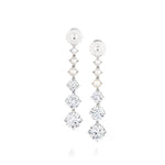 Introducing the Graduated Drop Ear Jackets in White Gold with Pearls and Round Brilliant Diamonds—an elegant pair of earrings featuring a vertical row of lustrous pearls above three sparkling round brilliant diamonds, expertly set in white gold. Perfect for those who appreciate sophisticated and customizable jewelry.