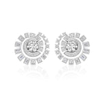 The Celestial Swirl Ear Jackets in white gold with mixed shape diamonds radiate celestial beauty, showcasing a swirling sunburst design with a large central round diamond encircled by smaller round and baguette-cut diamonds. Perfect for those seeking custom order jewelry inspired by the splendor of the skies.