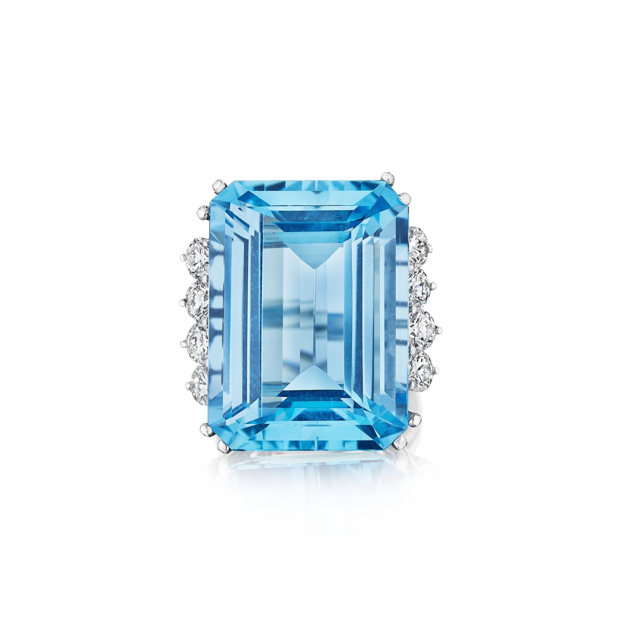 The Vintage Aquamarine and Diamond Ring features a large emerald-cut aquamarine accented by clusters of diamonds on each side, set in platinum and displayed against a white background.