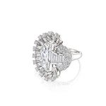 Introducing the Vintage Oscar Heyman & Brothers Diamond Ring: a platinum 1946 creation showcasing an oval center diamond, elegantly framed by baguette and round diamonds—including a distinctive half-moon diamond—set in an intricate, asymmetrical halo atop a simple band, embodying the iconic craftsmanship of Oscar Heyman & Brothers.