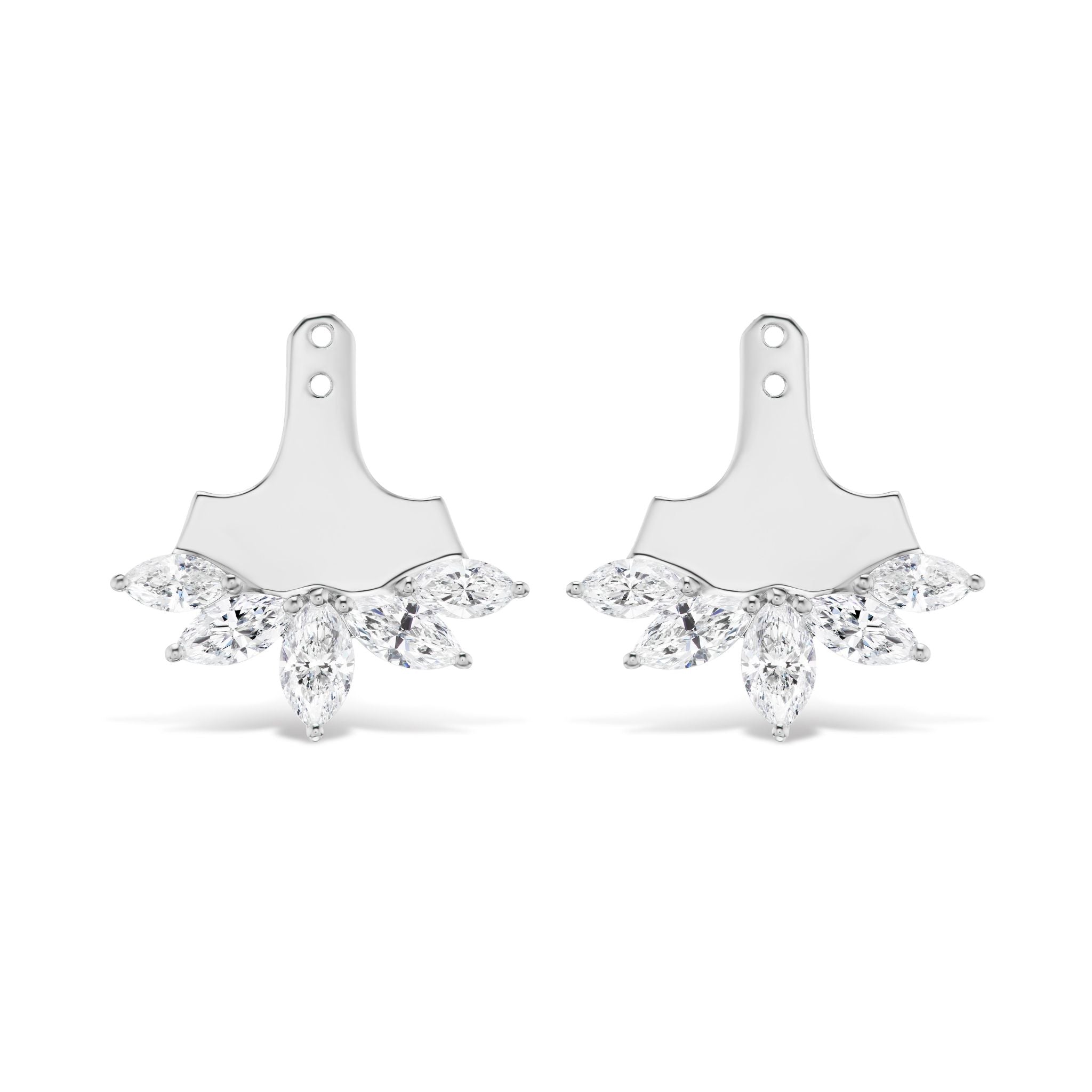 The Marquise Diamond Ear Jackets in White Gold feature a pair of silver earrings with a flat, paddle-shaped top and five marquise-cut clear gemstones arranged in a fan shape at the base. Their elegant design is enhanced by lustrous white gold detailing for a timeless finish, set against a white background.