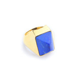 A luxurious Boucheron Lapis Lazuli and Gold Ring, circa 1930, crafted in 18 karat gold and featuring a prominent rectangular lapis lazuli gemstone with a faceted surface set atop the design.