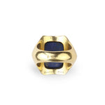 The Boucheron Lapis Lazuli and Gold Ring, circa 1930, showcases a striking hexagonal design in 18 karat gold, centered with a vivid blue lapis stone. The inscription “BOUCHERON PARIS” is engraved at the base and visible from the underside against a white background.