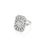 The Art Deco Diamond Ring, crafted in platinum circa 1925, showcases a prominent round old European-cut diamond at its center. Encircled by a geometric sunburst motif embellished with smaller diamonds, the ring is set on a simple band and presented against a white background.