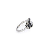 Vintage Onyx and Diamond Ring in platinum, size 6, featuring a rectangular clear diamond accented with black geometric onyx inlays, displayed from a side angle against a white background.