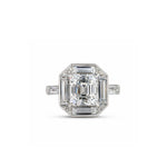 Showcasing the 1980s Diamond Ring, mounted by Oscar Heyman, this elegant square-shaped piece features an emerald-cut diamond at its center, beautifully accented by sparkling baguette diamonds. Set in a sleek platinum or white gold band and photographed against a plain white background, this exquisite ring comes with a GIA report to guarantee its quality and authenticity.
