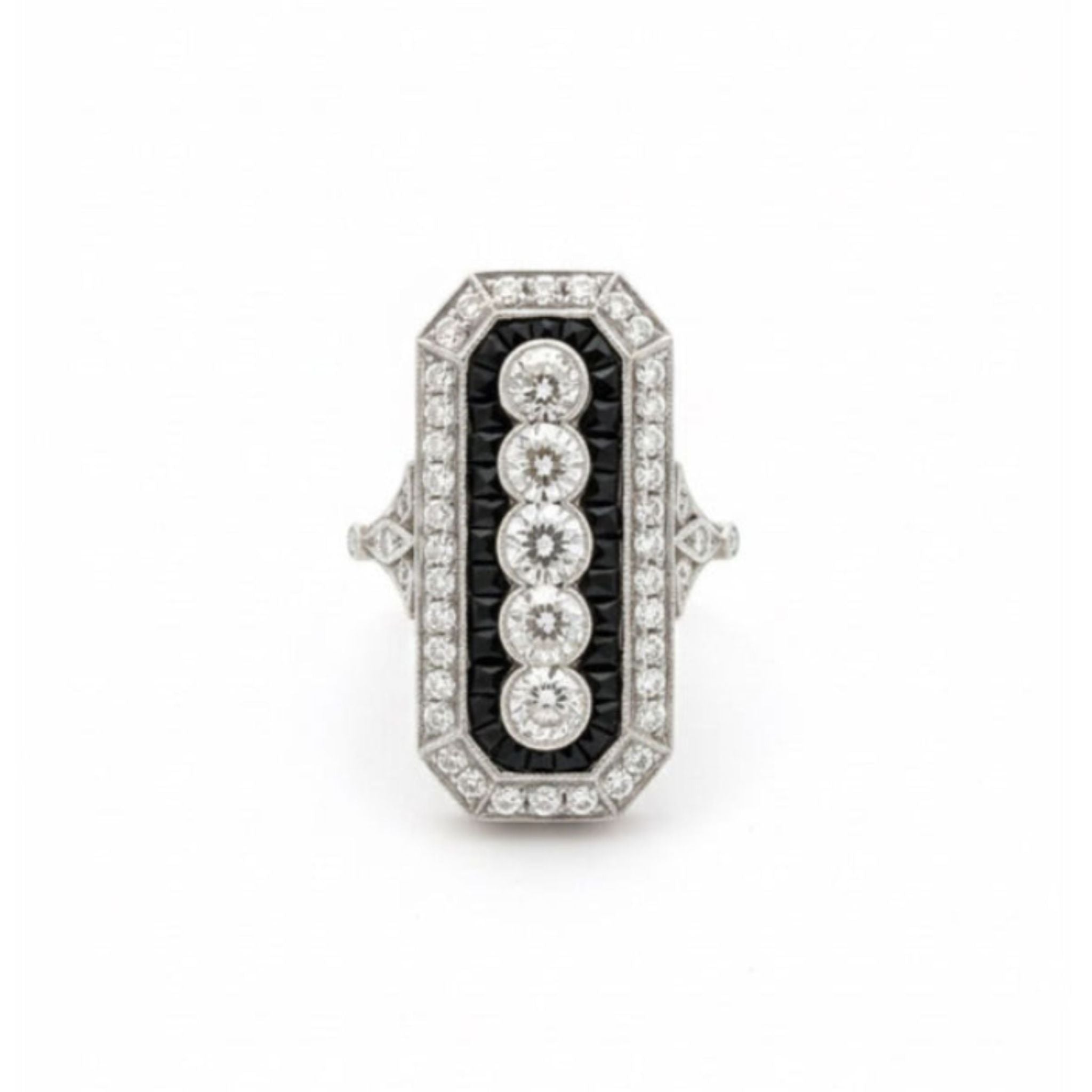 Onyx and Diamond Ring in Art Deco style, circa 1925, showcasing a rectangular design with a central row of five old mine-cut diamonds. The ring is accented by smaller diamonds and bold black calibré-cut onyx detailing, all set on a platinum band.