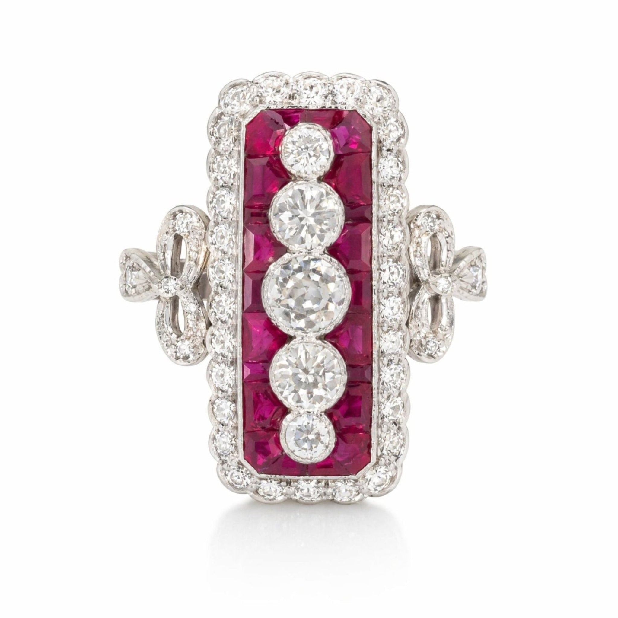 The Ruby and Diamond Ring features four old European-cut diamonds set vertically, bordered by calibré-cut rubies and double diamond halos, with decorative sides on a platinum and 18K white gold band.