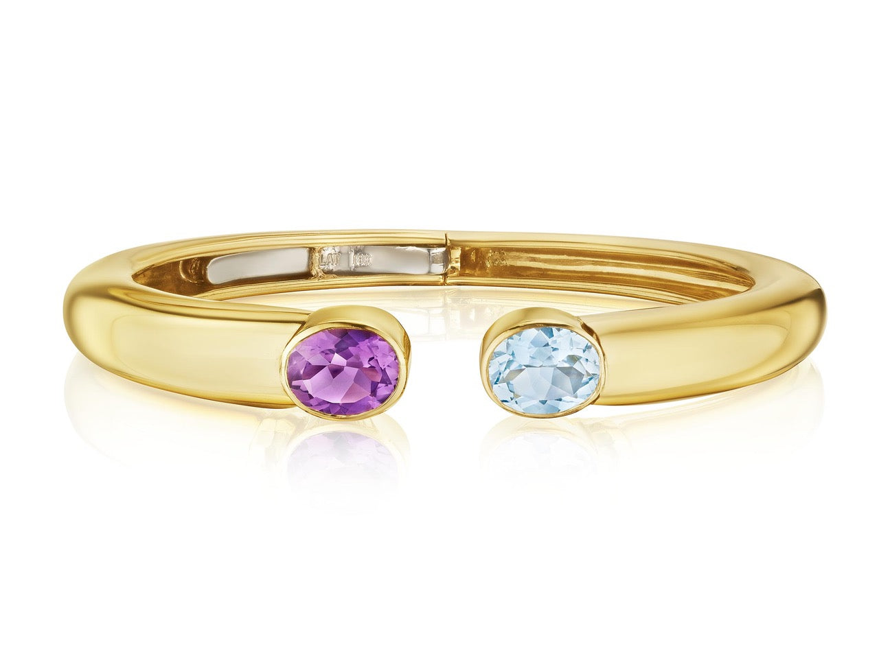 The Bezel Set Open Space bangle features oval Aquamarine and Amethyst gemstones set in yellow gold, shown on a white background.