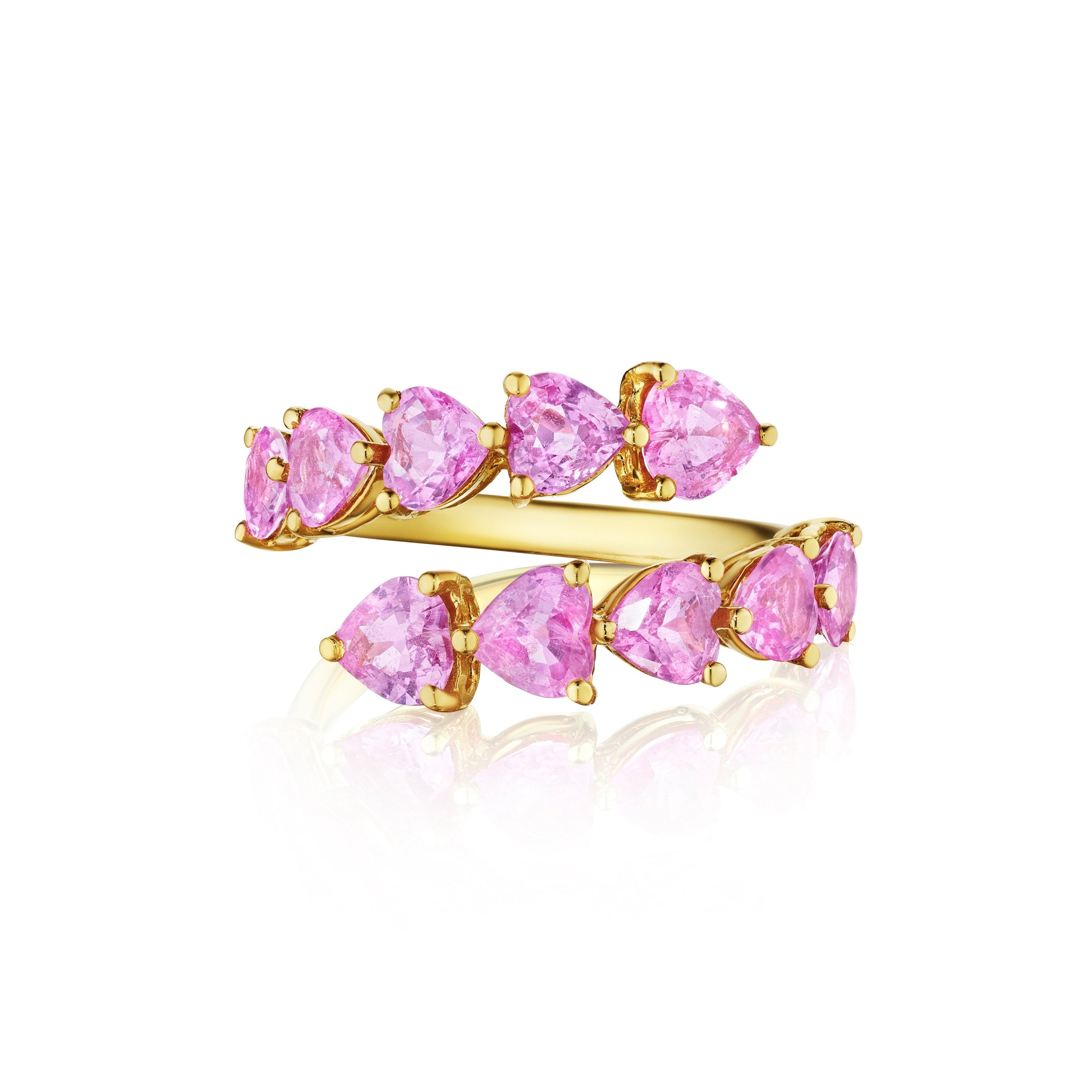 The Chasing Hearts Wraparound Ring features double 18K yellow gold bands, each adorned with pink sapphire heart-shaped gems arranged in a staggered pattern.