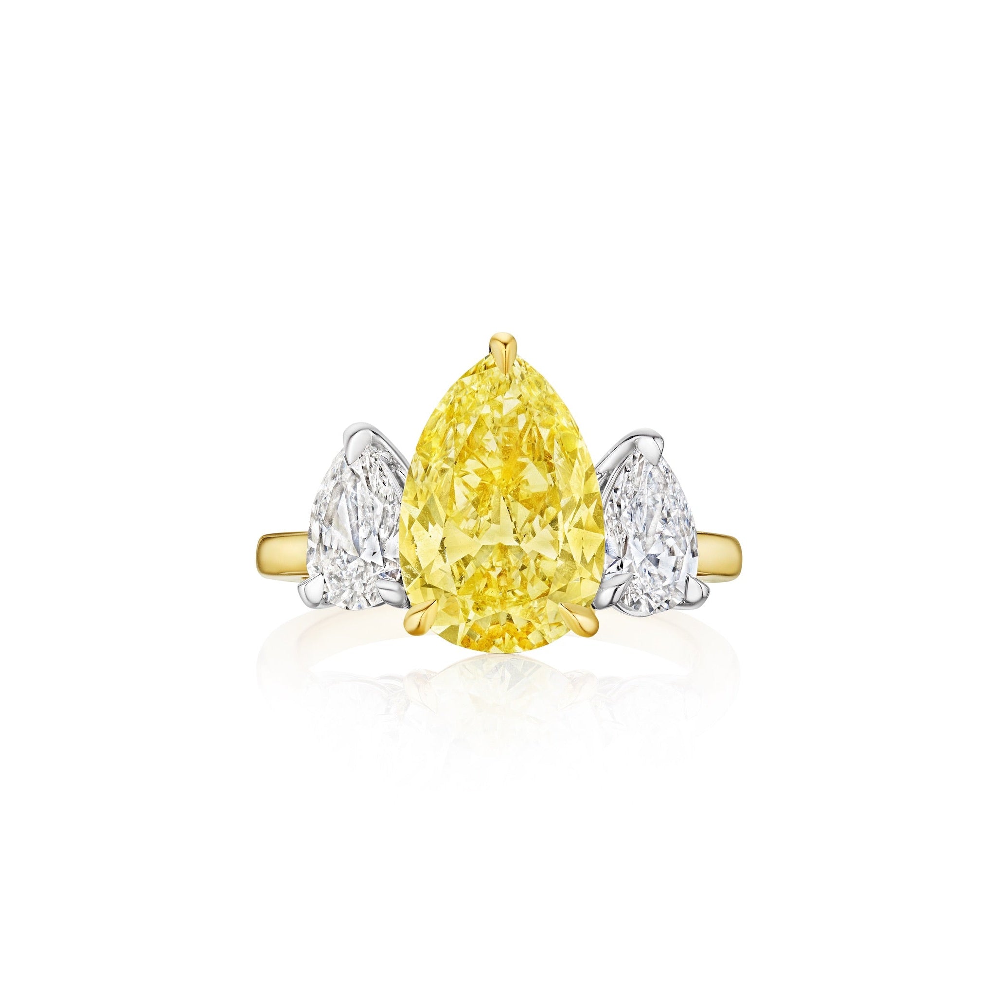 The North-South Set Pear Shape Yellow Diamond Engagement Ring features a central fancy yellow pear-shaped diamond, accented by pear-shaped white diamond side stones, set on an elegant 18k gold and white metal band.