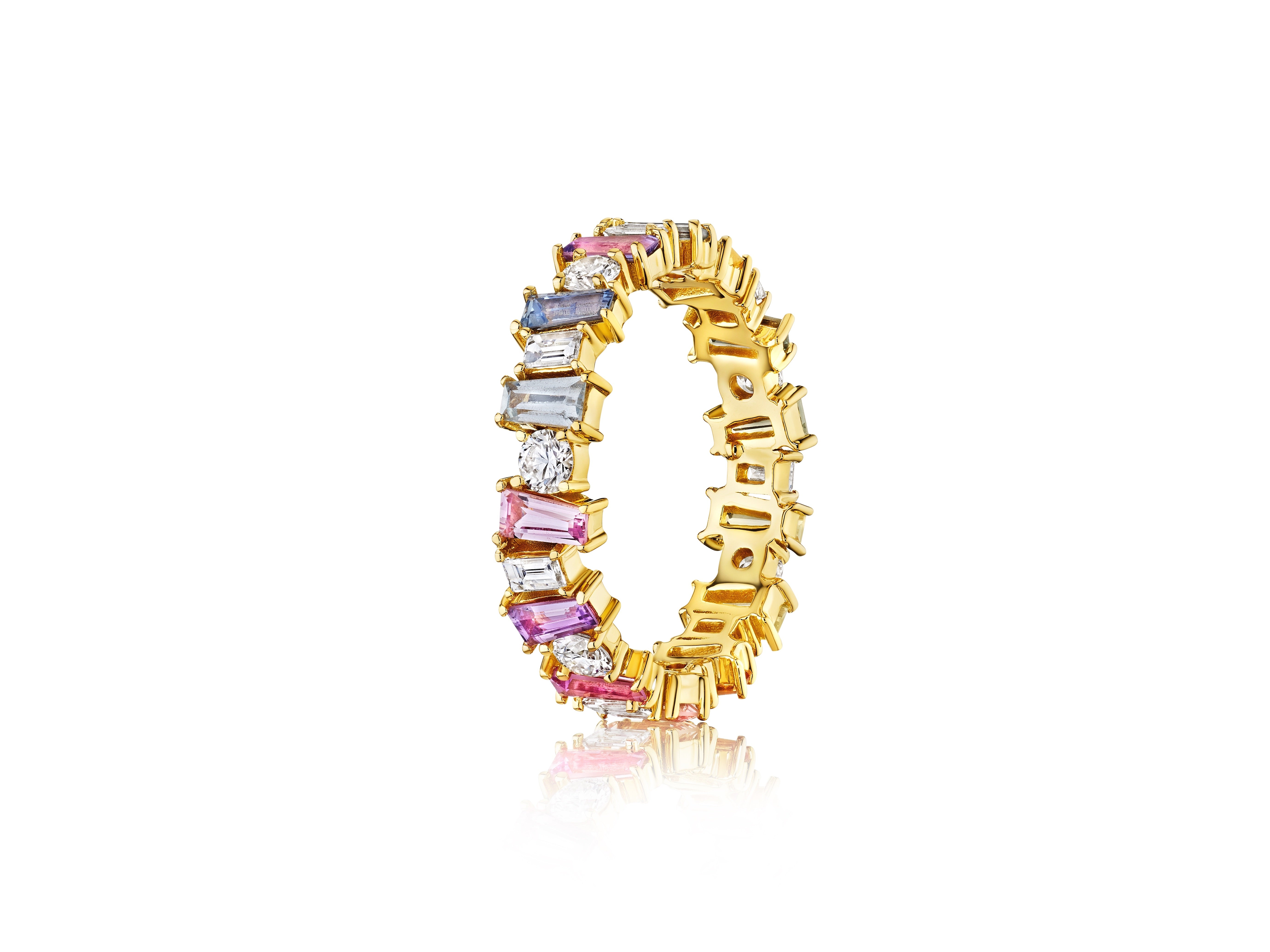 The Multicolor Eternity Band in Yellow Gold features alternating tapered baguette sapphires and round diamonds set in 18K yellow gold, shown against a white background.