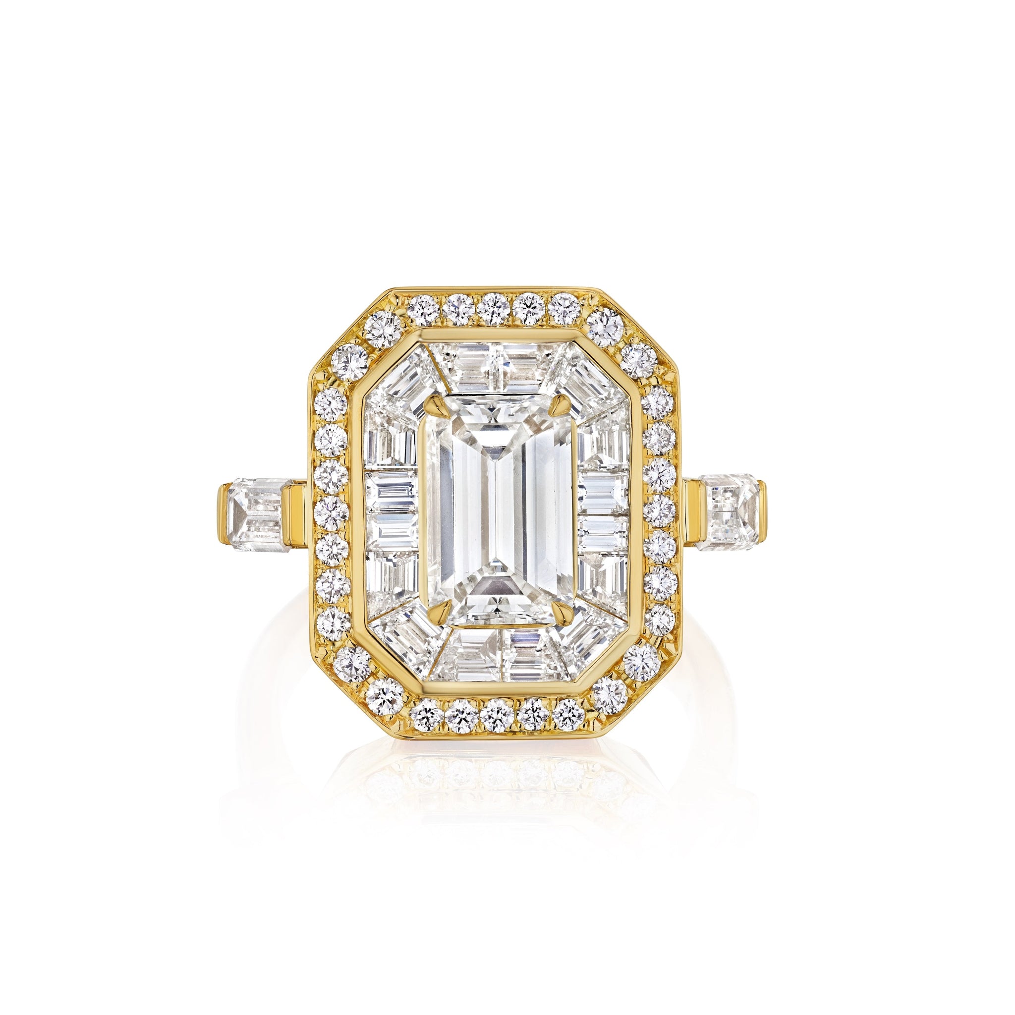 The Bespoke Mosaic Statement Double Halo Set Ring in Yellow Gold with Mixed Shape Diamond showcases an emerald-cut diamond center, framed by a double halo of mixed shape diamonds, creating a striking statement piece.