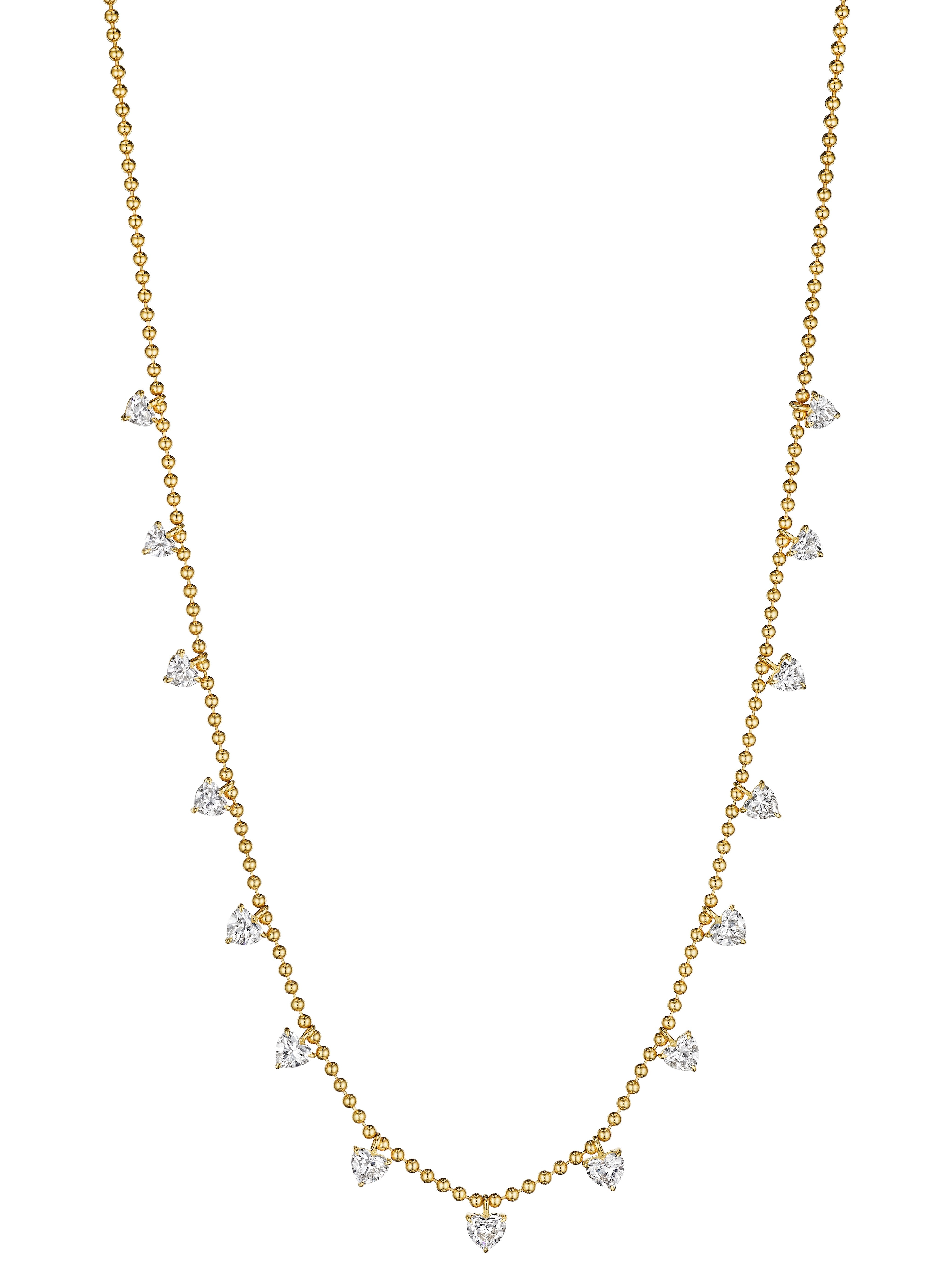 A delicate Heart Shape Diamond Station Necklace featuring a yellow gold ball chain and spaced heart-shaped diamonds along the lower half.