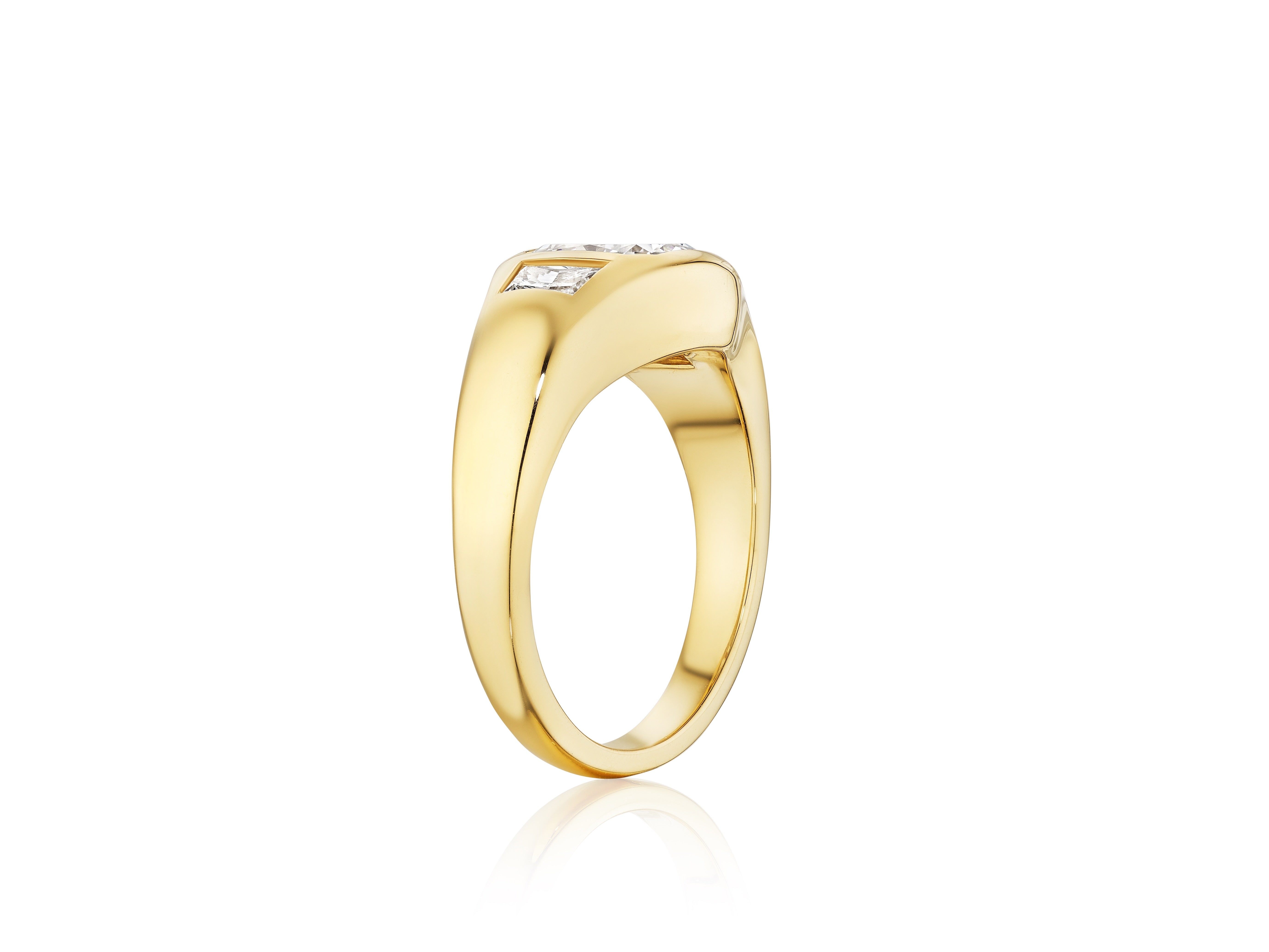The Radiant Cut Diamond Gypsy Ring in Yellow Gold features a thick 18K yellow gold band and a flat-set rectangular radiant cut diamond, shown against a white background.