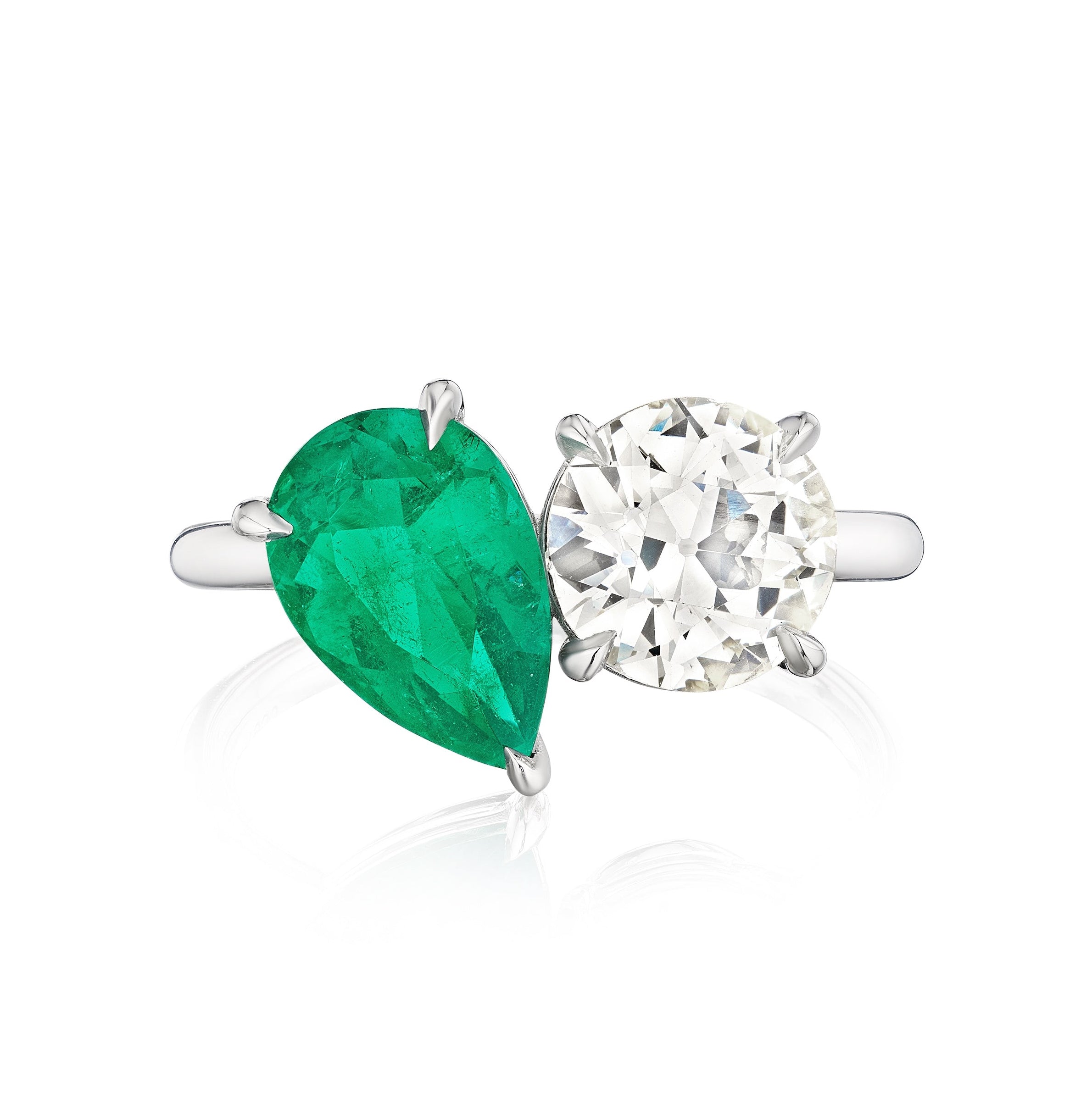 The Bespoke Toi et Moi Pear Shape Emerald and Round Diamond Engagement Ring in White Gold pairs a pear shape emerald with a round diamond on a sleek band, making it an elegant choice for an engagement ring.