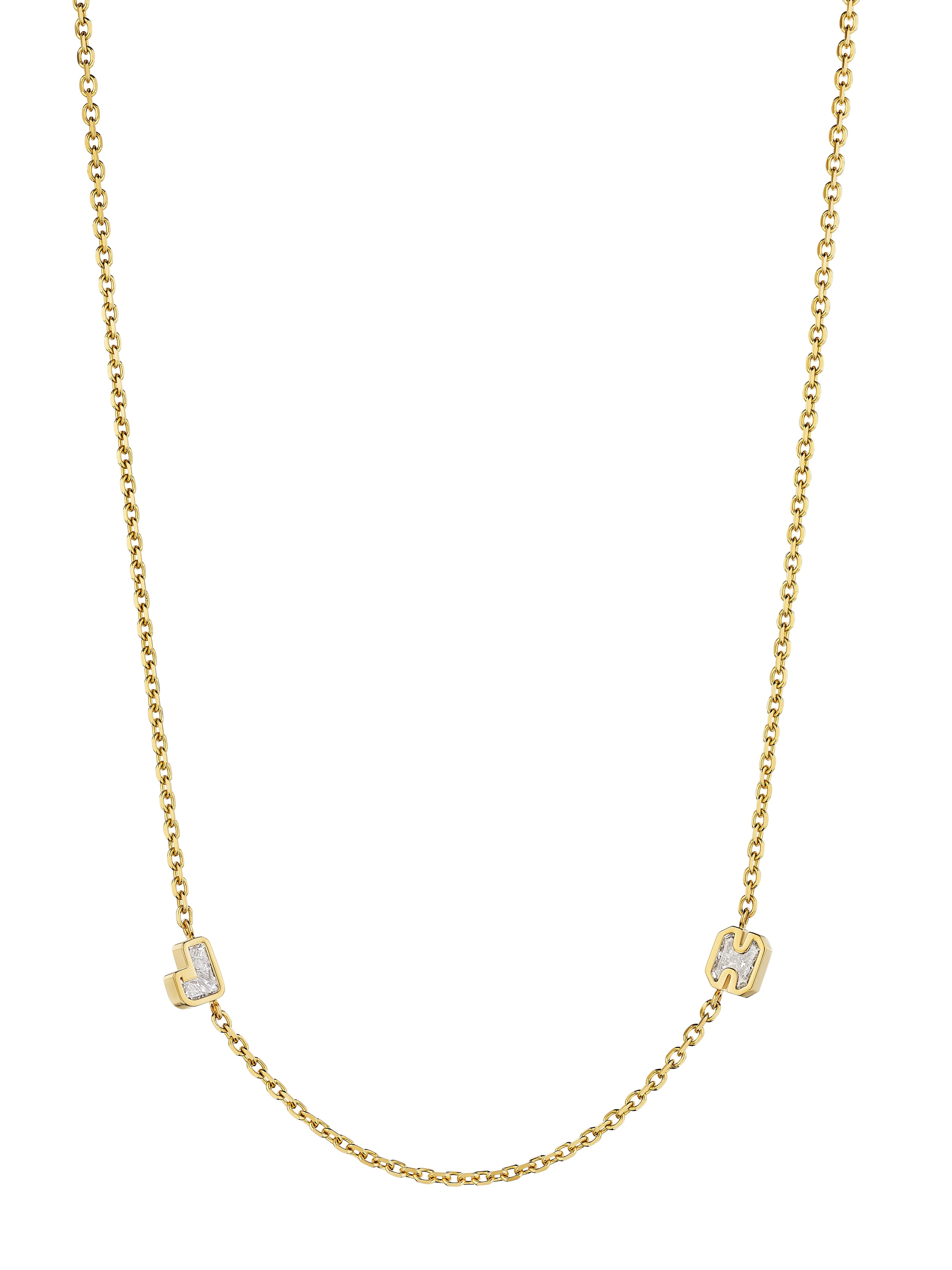 The Bespoke Bezel Set Diamond Initial Necklace in Yellow Gold showcases two small, square letter charms—J and H—spaced apart on a delicate chain for a subtle, personalized touch.