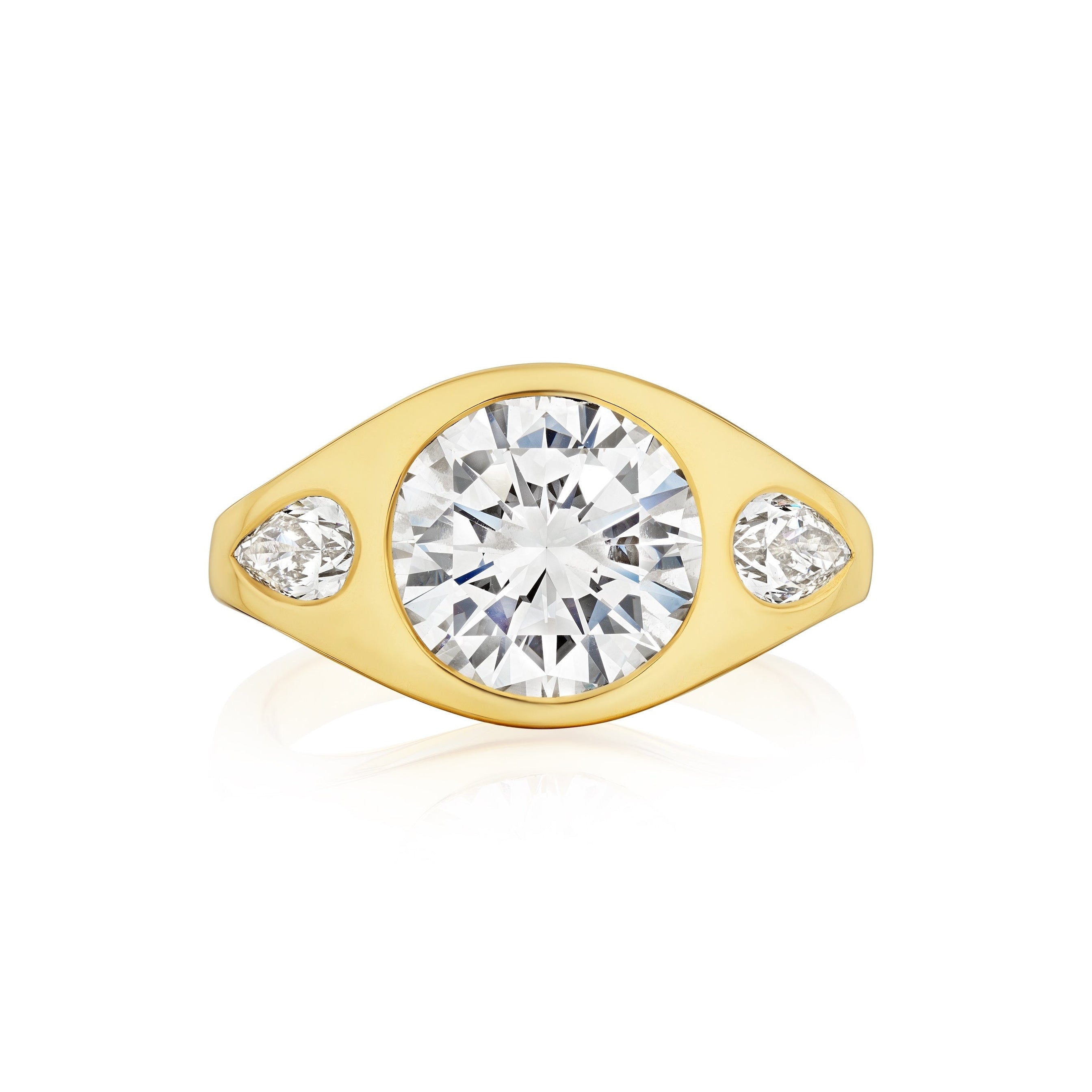 The Bespoke Burnish Set Gypsy Ring in yellow gold features round and pear-shaped diamonds set on a polished band—a stunning piece you can customize to suit your unique style.