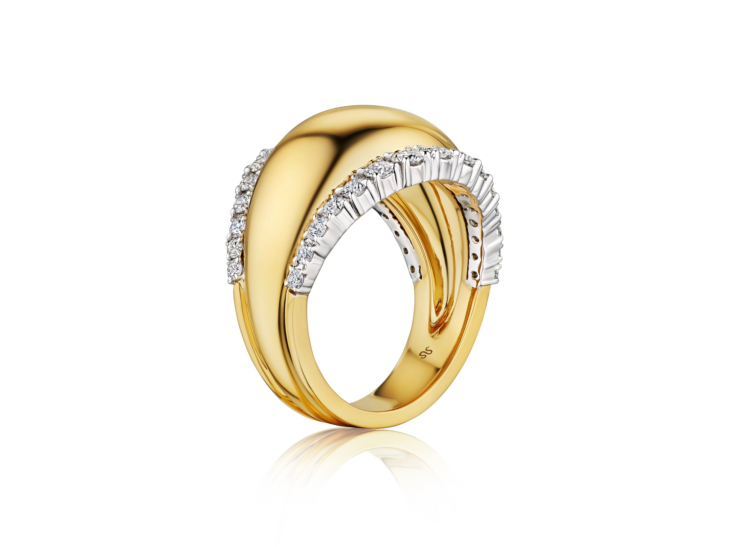 The Coil Dome Ring with Pavé Diamond Borders in yellow gold features a modern curved design with pavé and baguette diamonds on one side, shown on a reflective white surface.