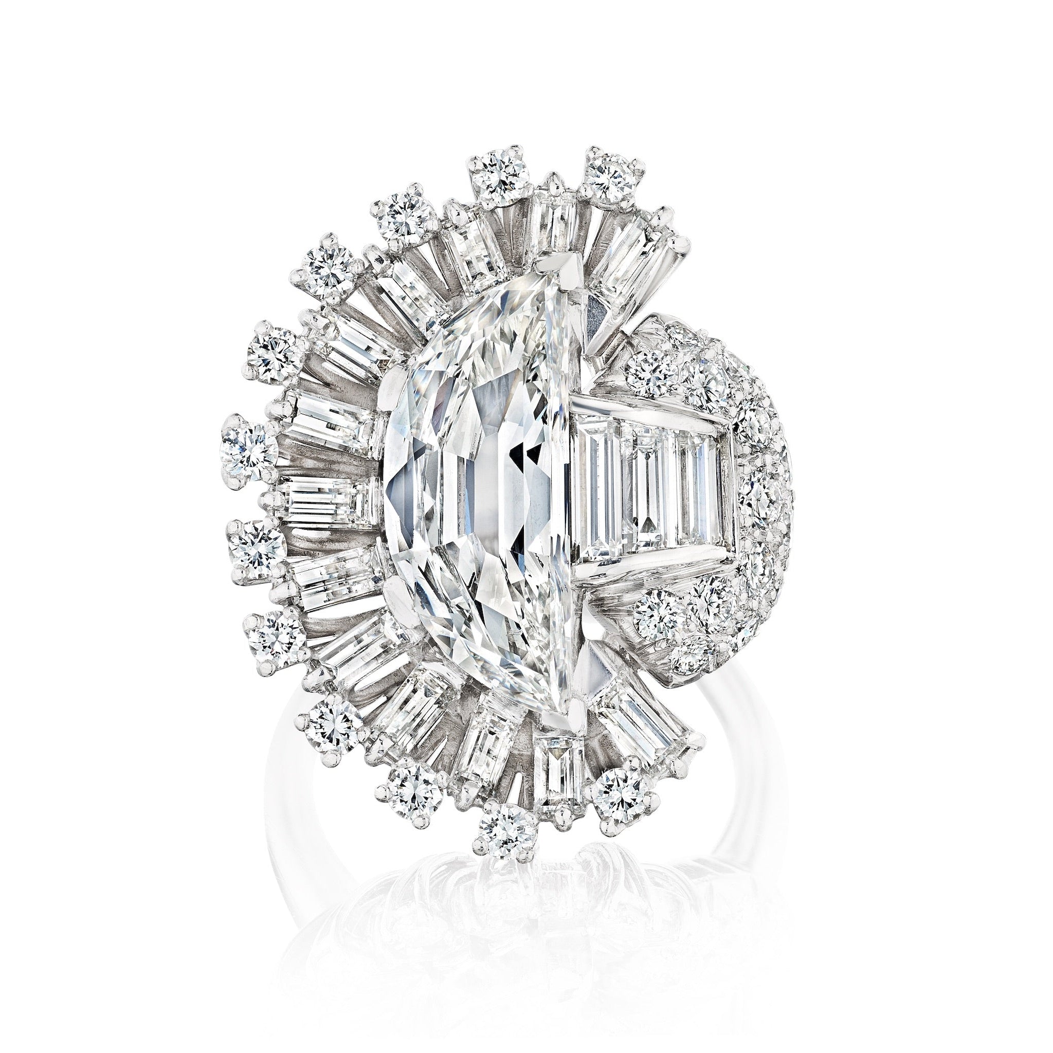 The Oscar Heyman & Brothers Diamond Ring showcases a central oval diamond with half-moon accents, set among round and baguette diamonds in an elaborate platinum 1946 design.