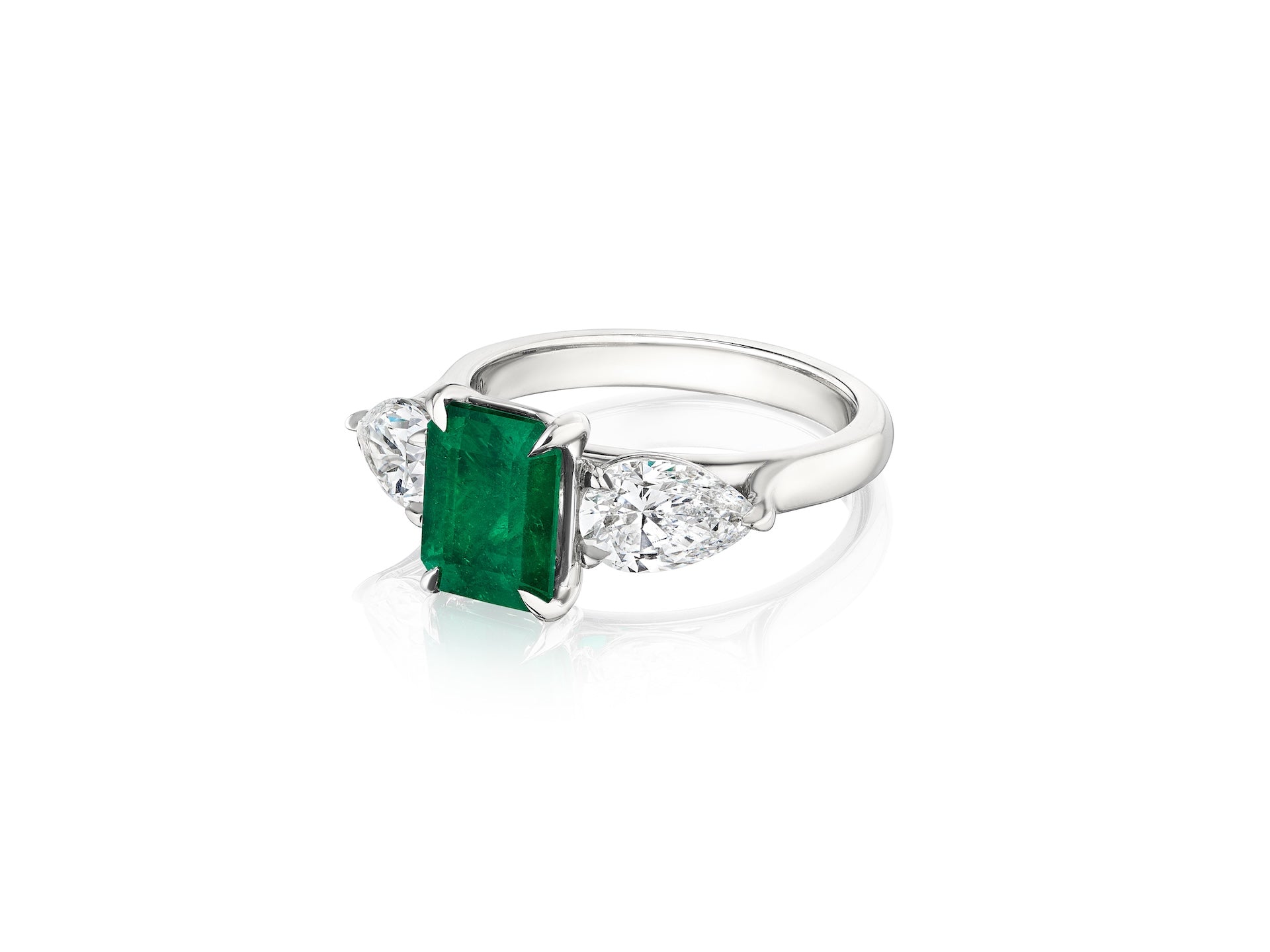 Emerald Cut Emerald Center Stone With Pear Shape White Diamond Side Stones Set in Platinum