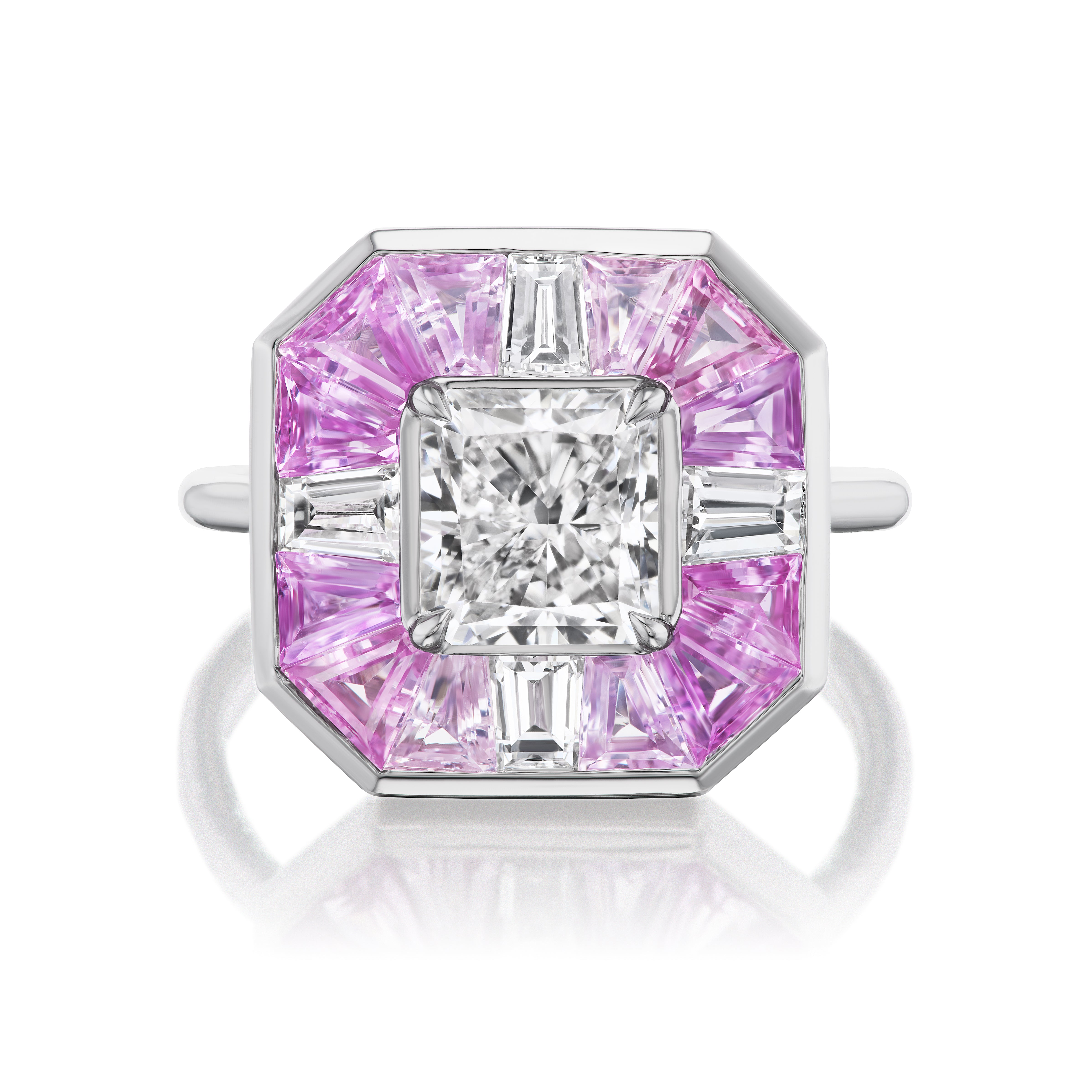 The Mosaic Ring features a radiant cut diamond center with baguette diamonds and pink sapphires in an octagonal design.