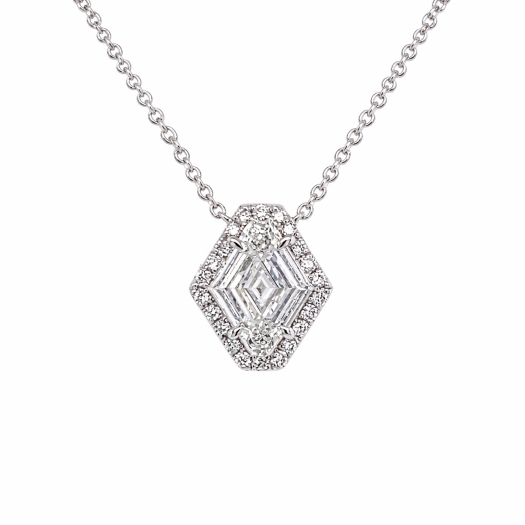 The North-South Shield Diamond Necklace in White Gold features a hexagon-shaped pendant with baguette, brilliant, and round diamonds in a geometric pattern on an 18k white gold chain, shown against a white background.