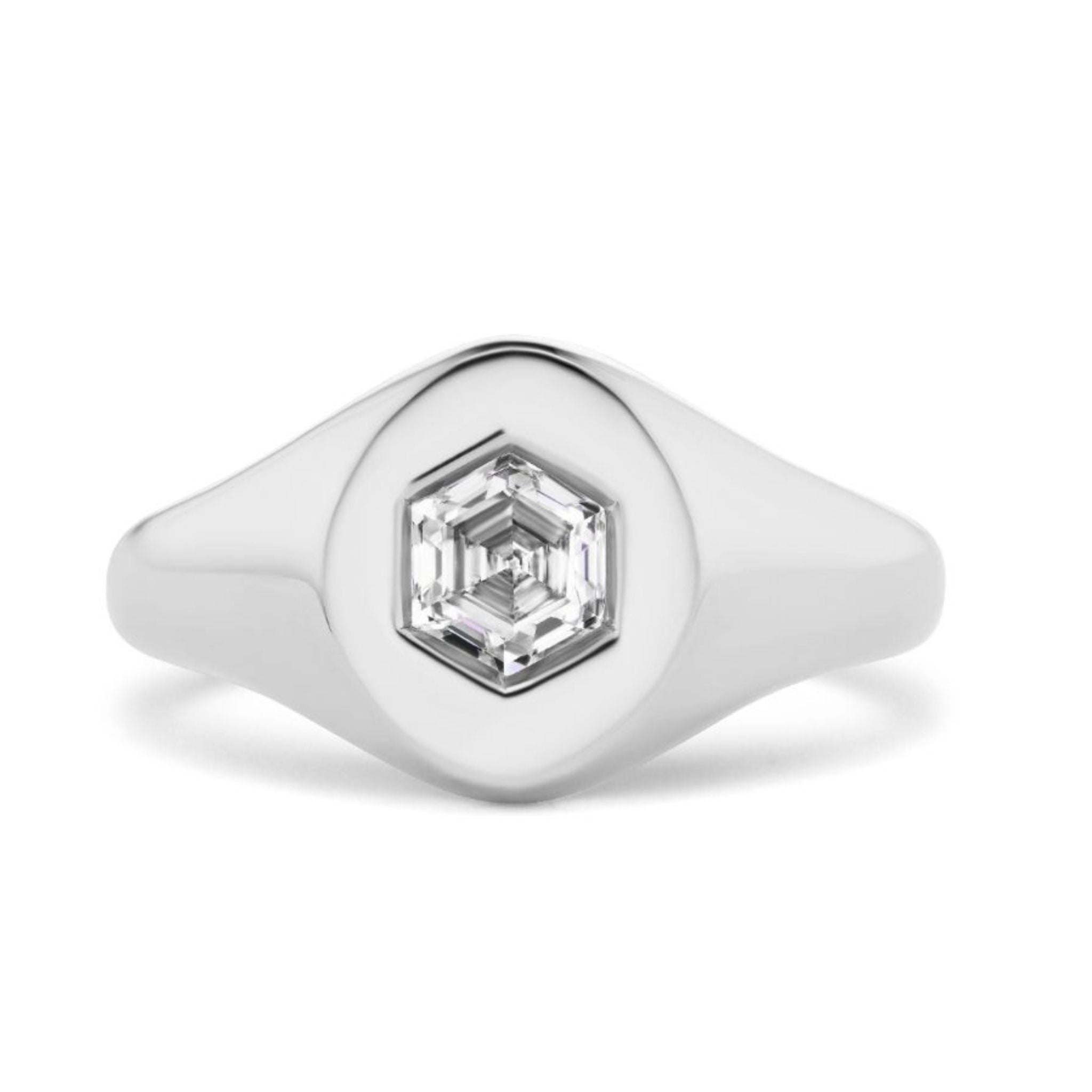 The Signet Ring with Hexagon Diamond features a sleek, polished silver band and a central hexagonal diamond for a modern look.