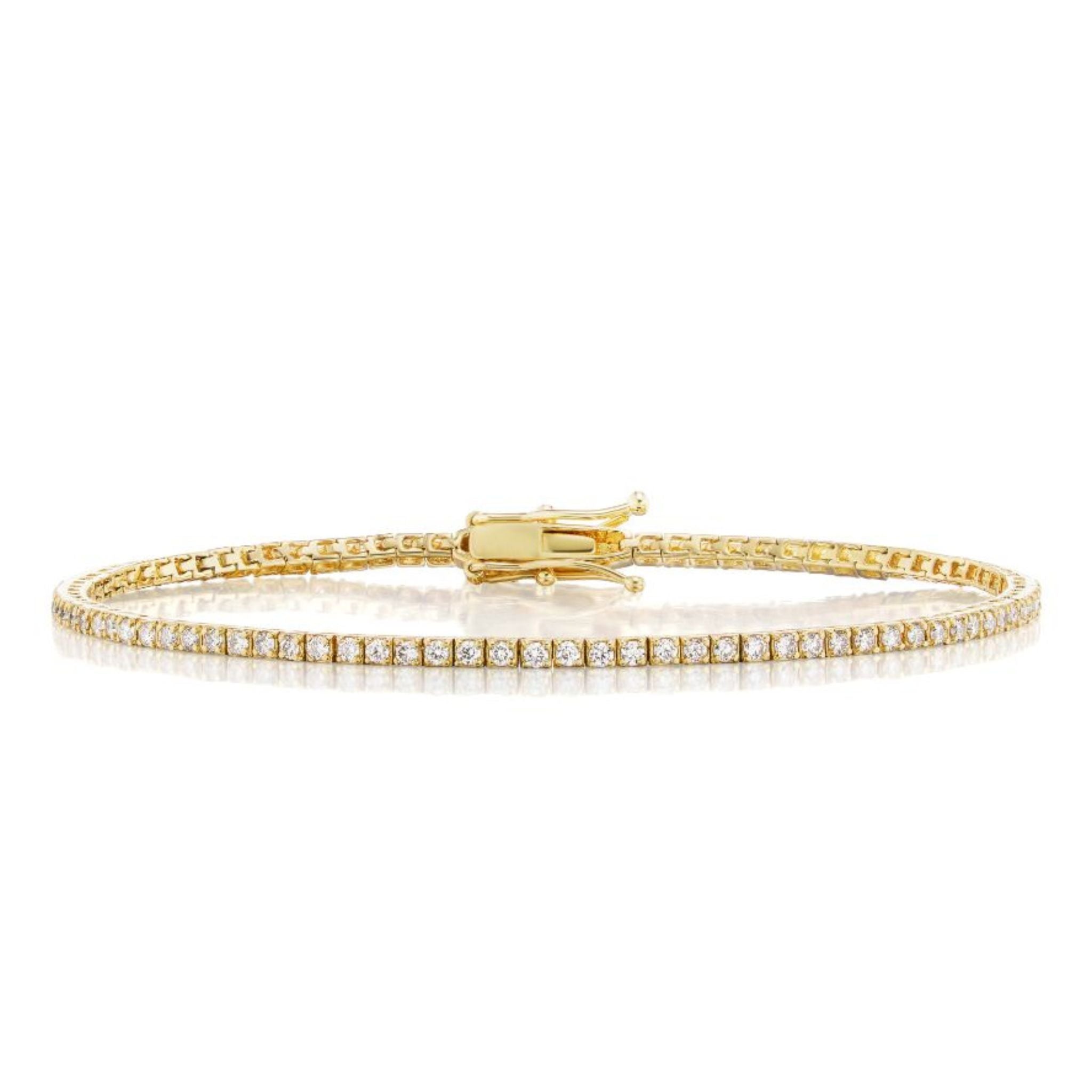 The Skinny Round Brilliant Diamond Tennis Bracelet in white gold features a row of sparkling round diamonds and a secure clasp, beautifully displayed against a white background.