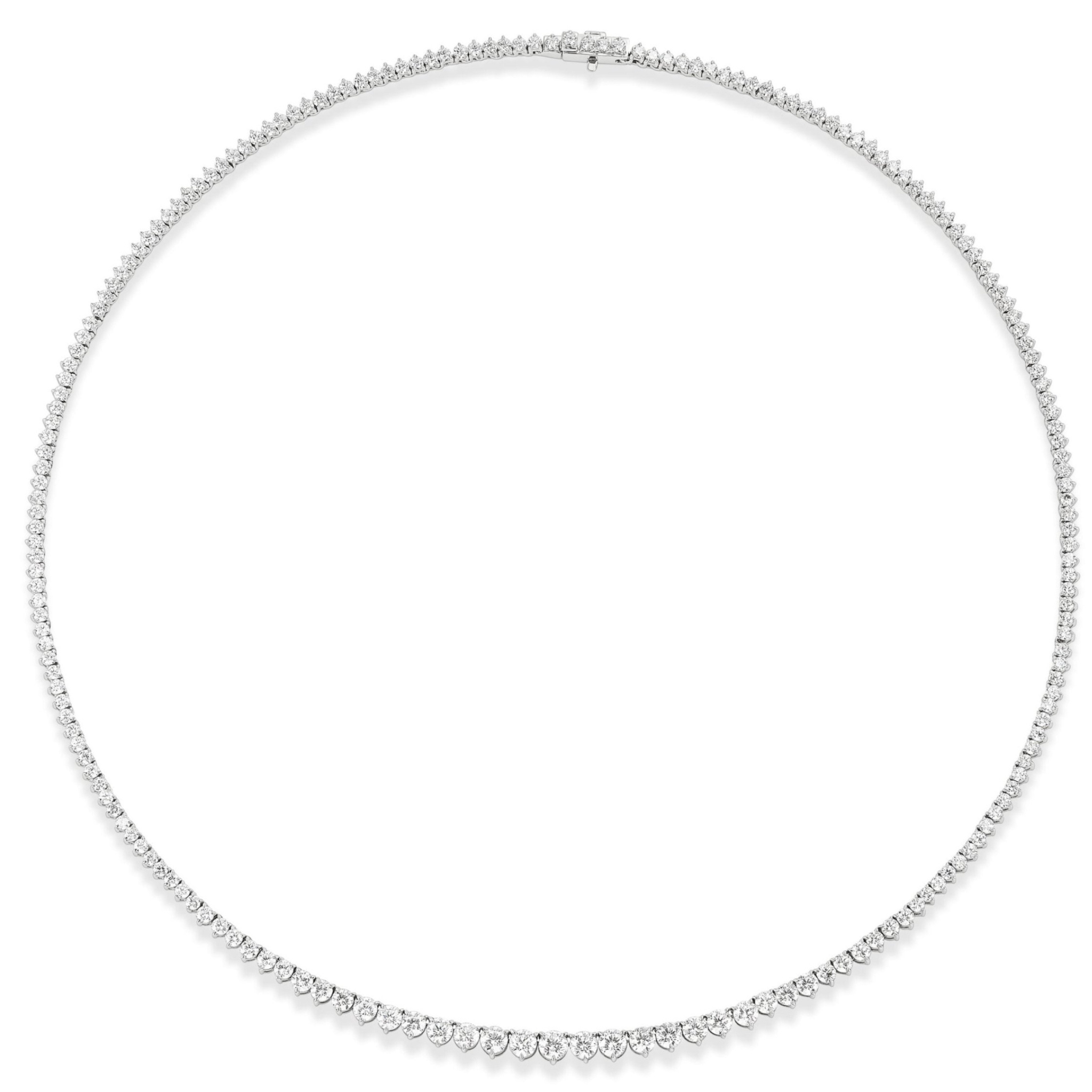 The Small Graduated Round Diamond Tennis Necklace features delicate, closely set round diamonds in a thin line of 18k gold, elegantly displayed against a white background.