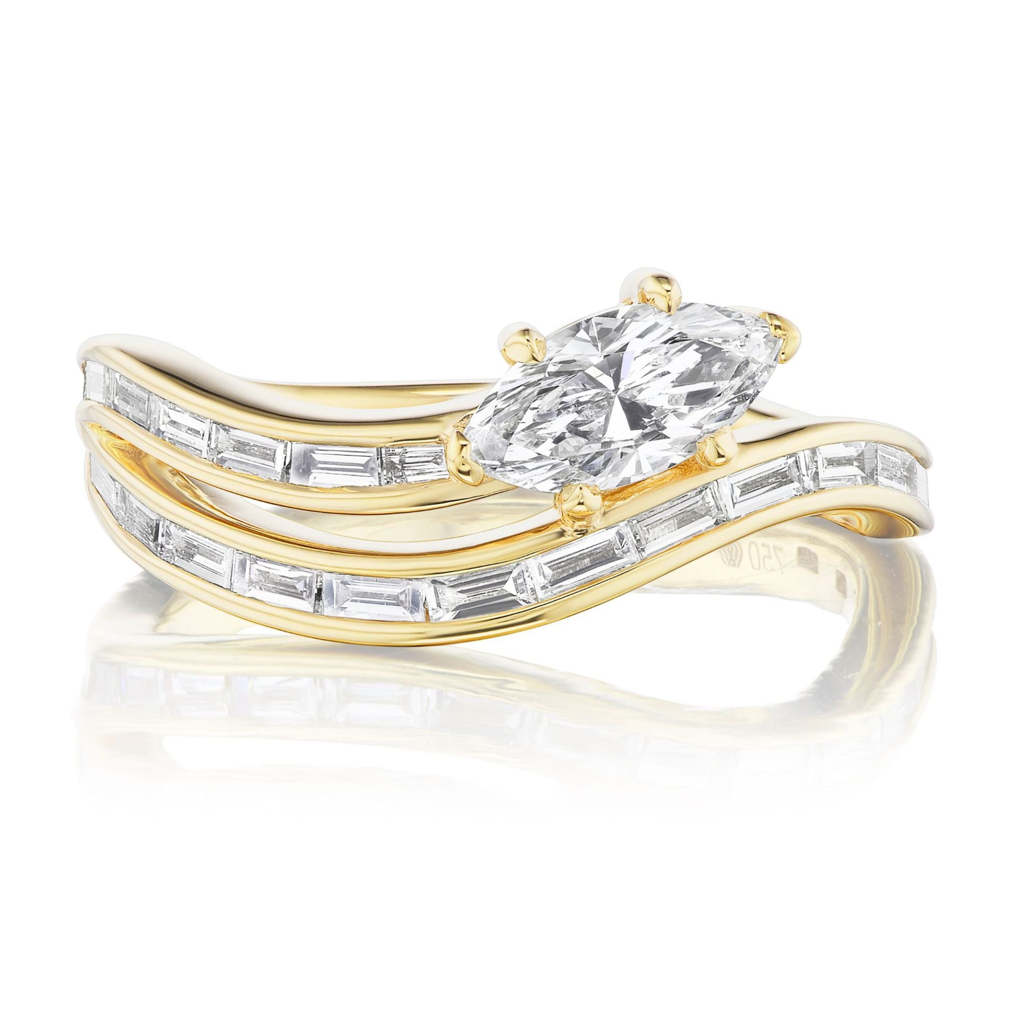 The Snake Wave Channel Set Baguette Diamond Ring with Marquise Diamond in Yellow Gold features two wavy 18K yellow gold bands set with baguette diamonds and a horizontally set marquise-cut diamond centerpiece.