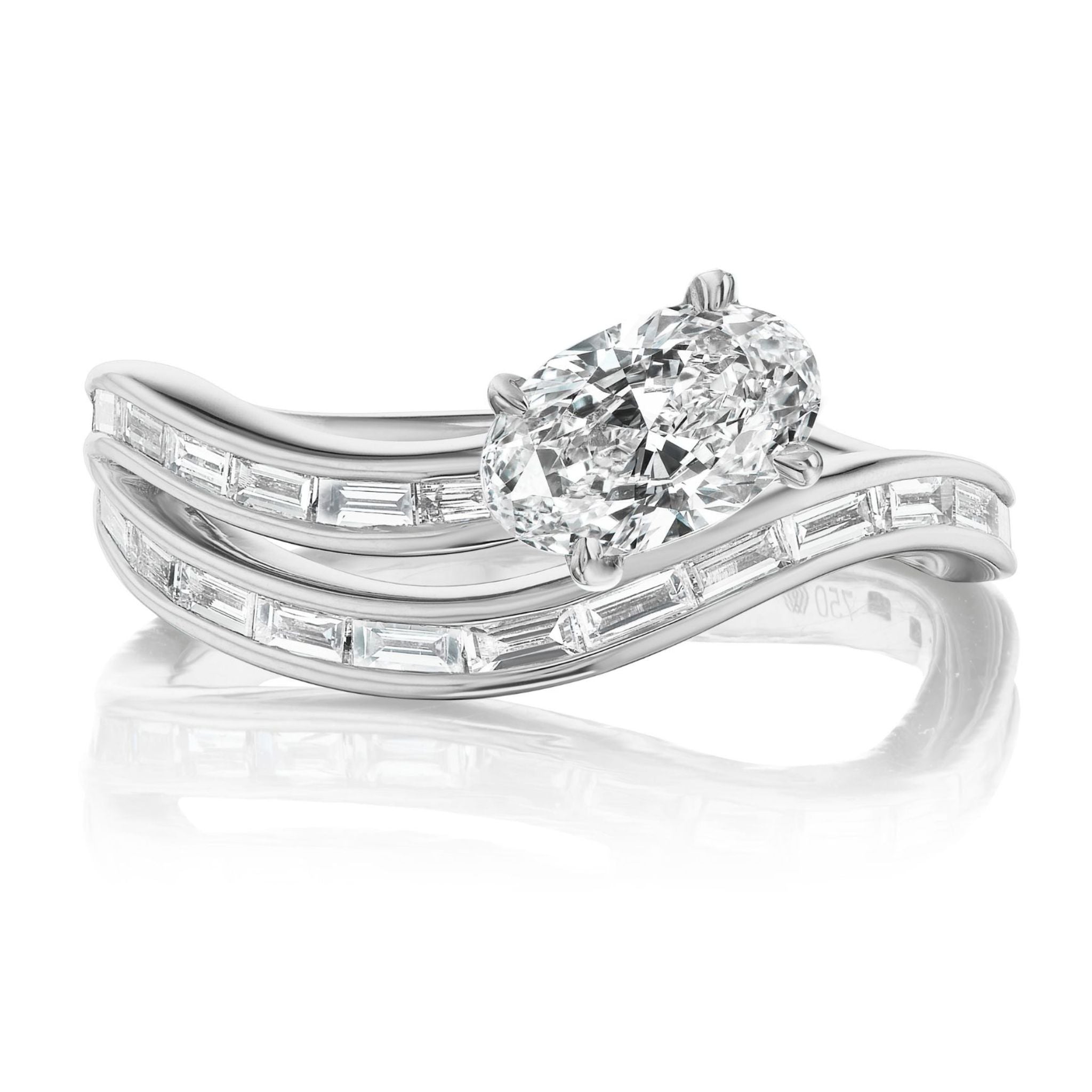 The Snake Wave Channel Set Baguette Diamond Ring with Oval Diamond features a dazzling center stone and wavy bands accented with shimmering baguette diamonds, elegantly displayed on a reflective surface.